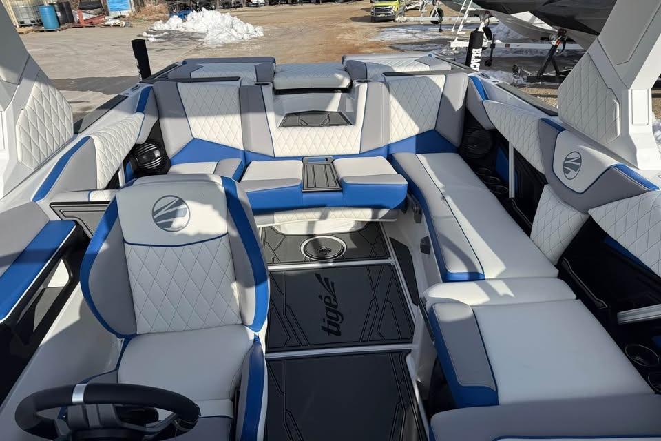2026 Tigé Z3 boat interior with blue and white seating, showcasing luxury design.