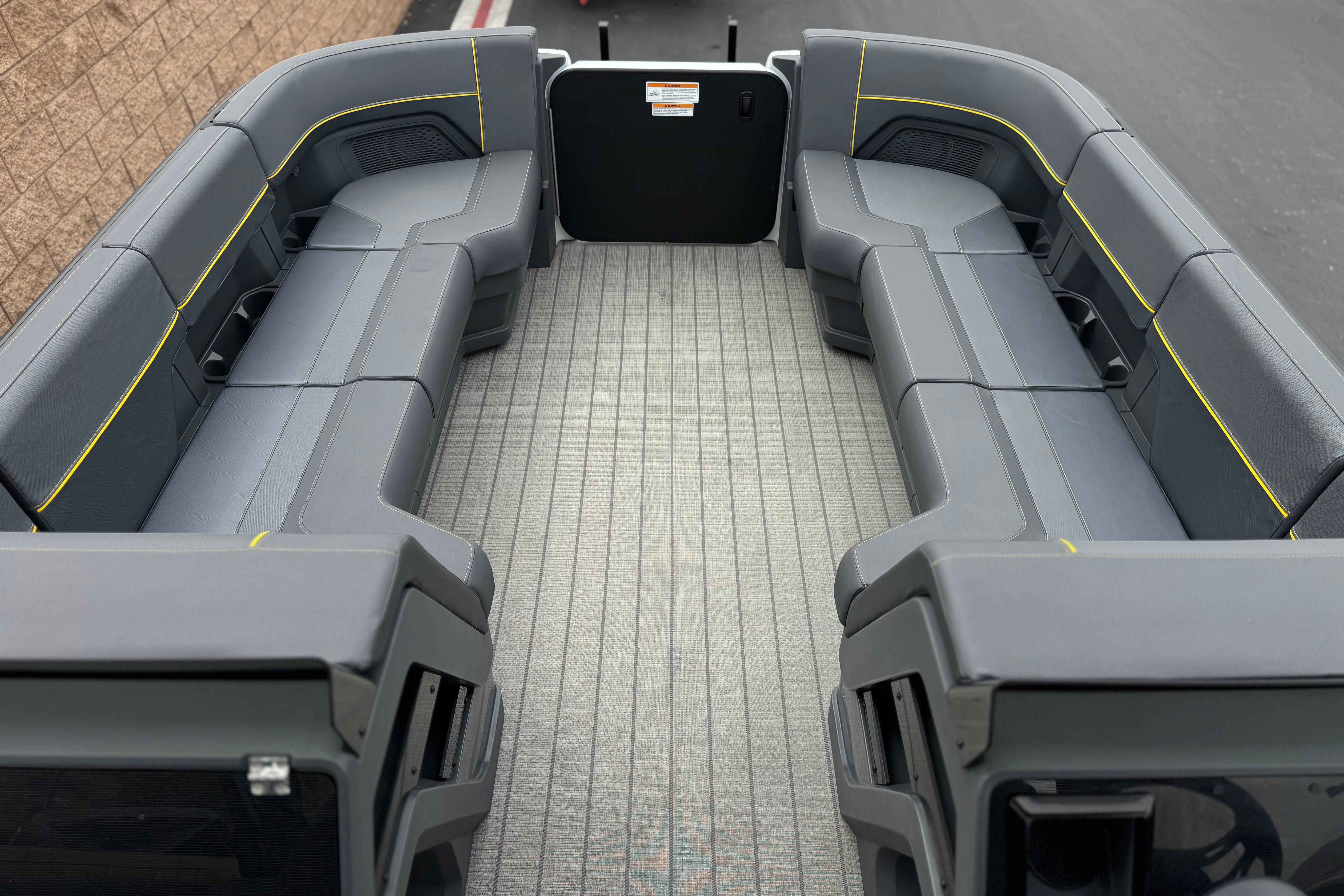 2025 Manitou EXPLORE 24 boat interior with spacious seating and modern design.