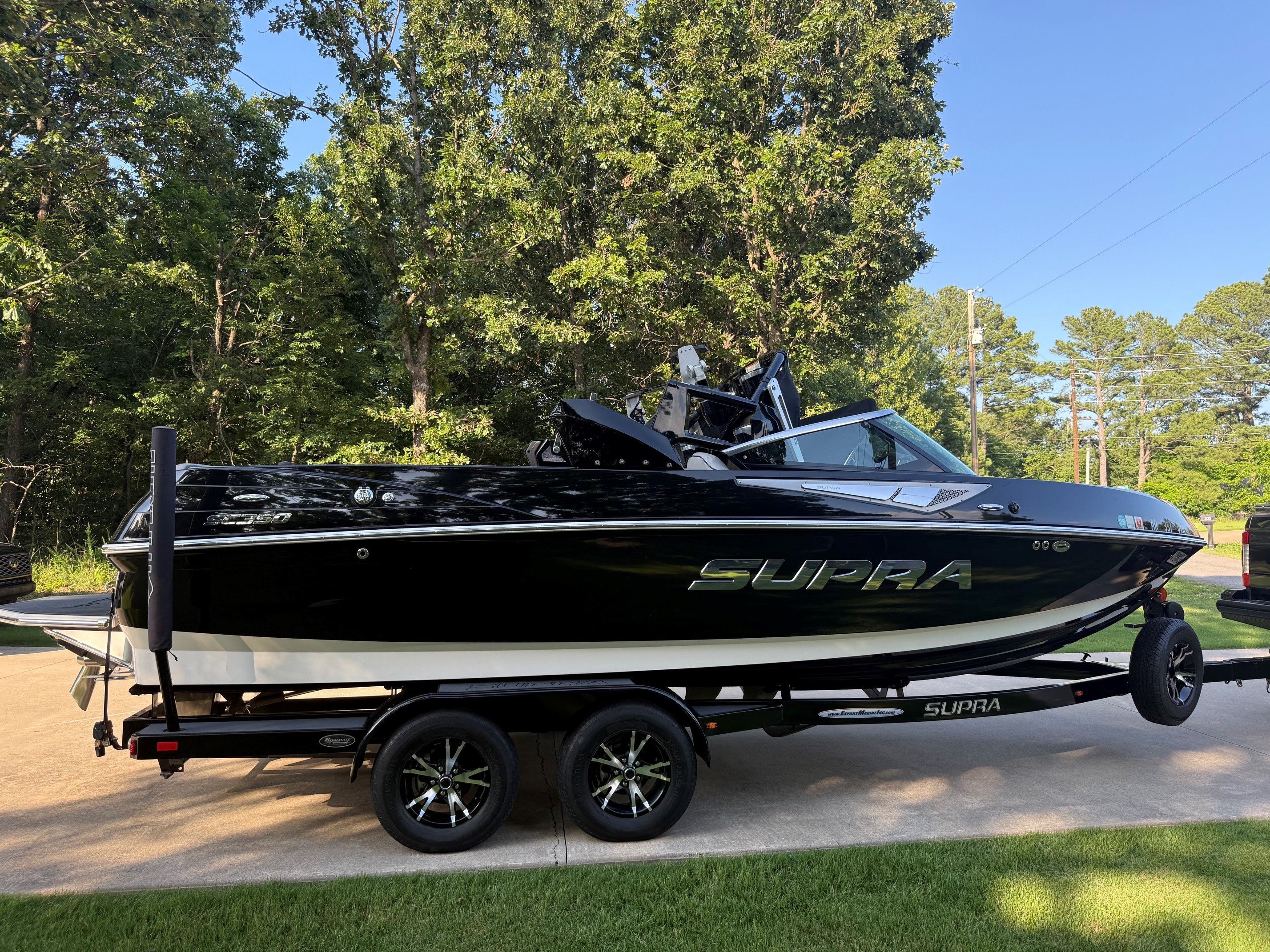 2014 Supra SC350 parked outdoors on a trailer.