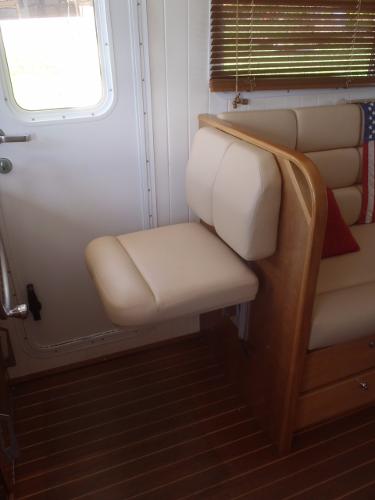 Interior of 2025 Great Harbour N40 yacht with beige seating and wooden accents.