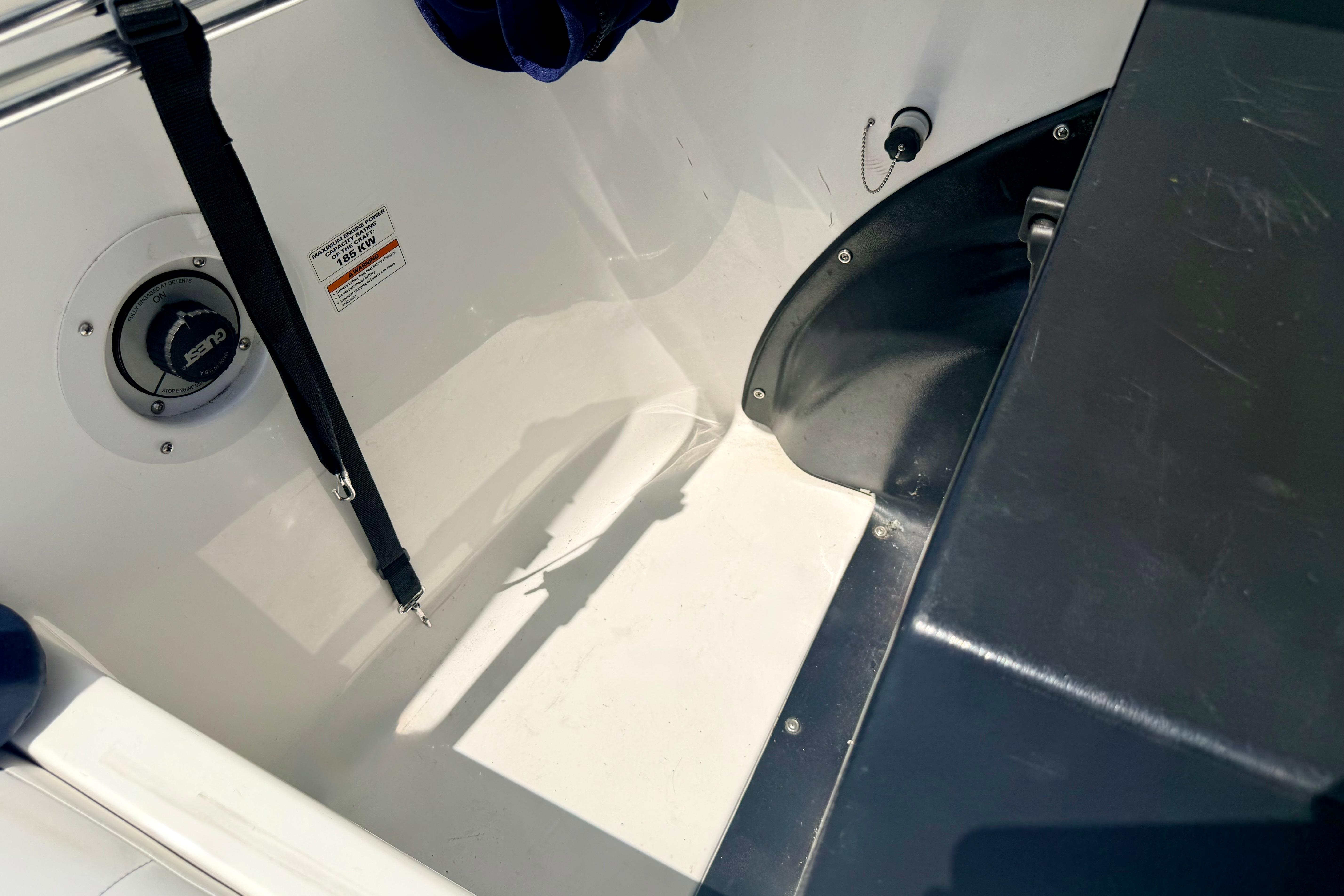 Interior view of a 2004 Bombardier SEADOO Utopia 185 boat, featuring seating and safety equipment.