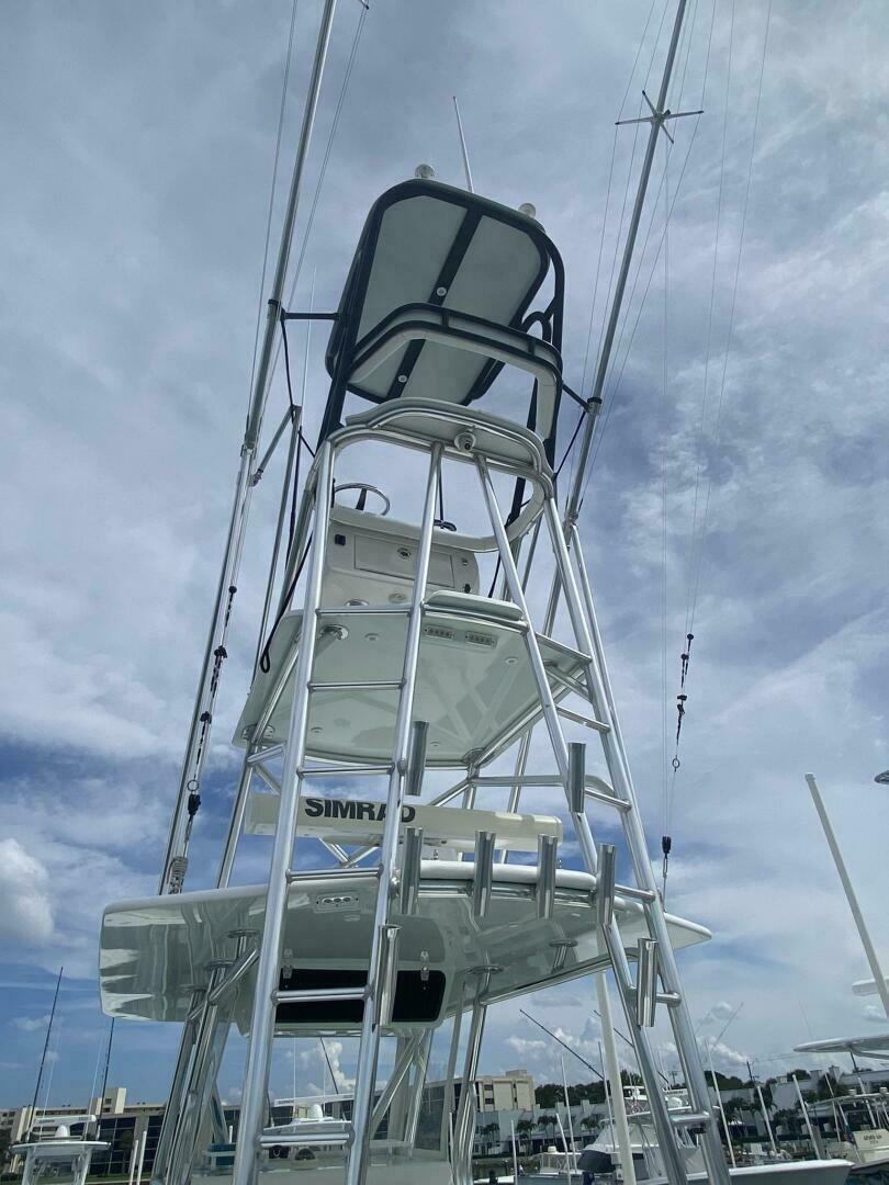 2012 Contender 39ST boat tower with multiple levels against a cloudy sky.
