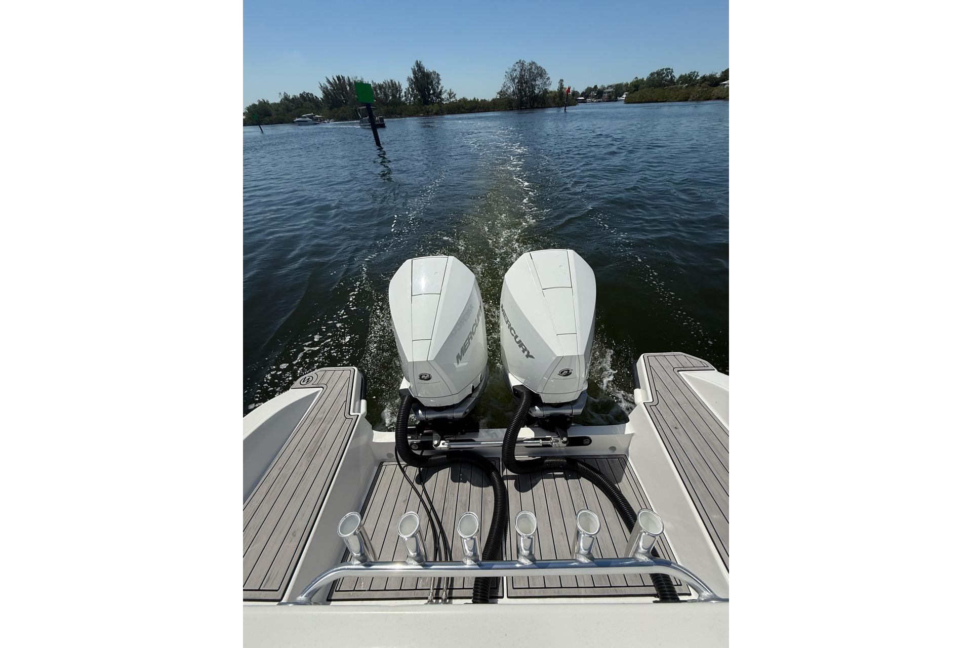 Custom Infusion 34 CC 2021 boat with dual Mercury outboard engines on water.