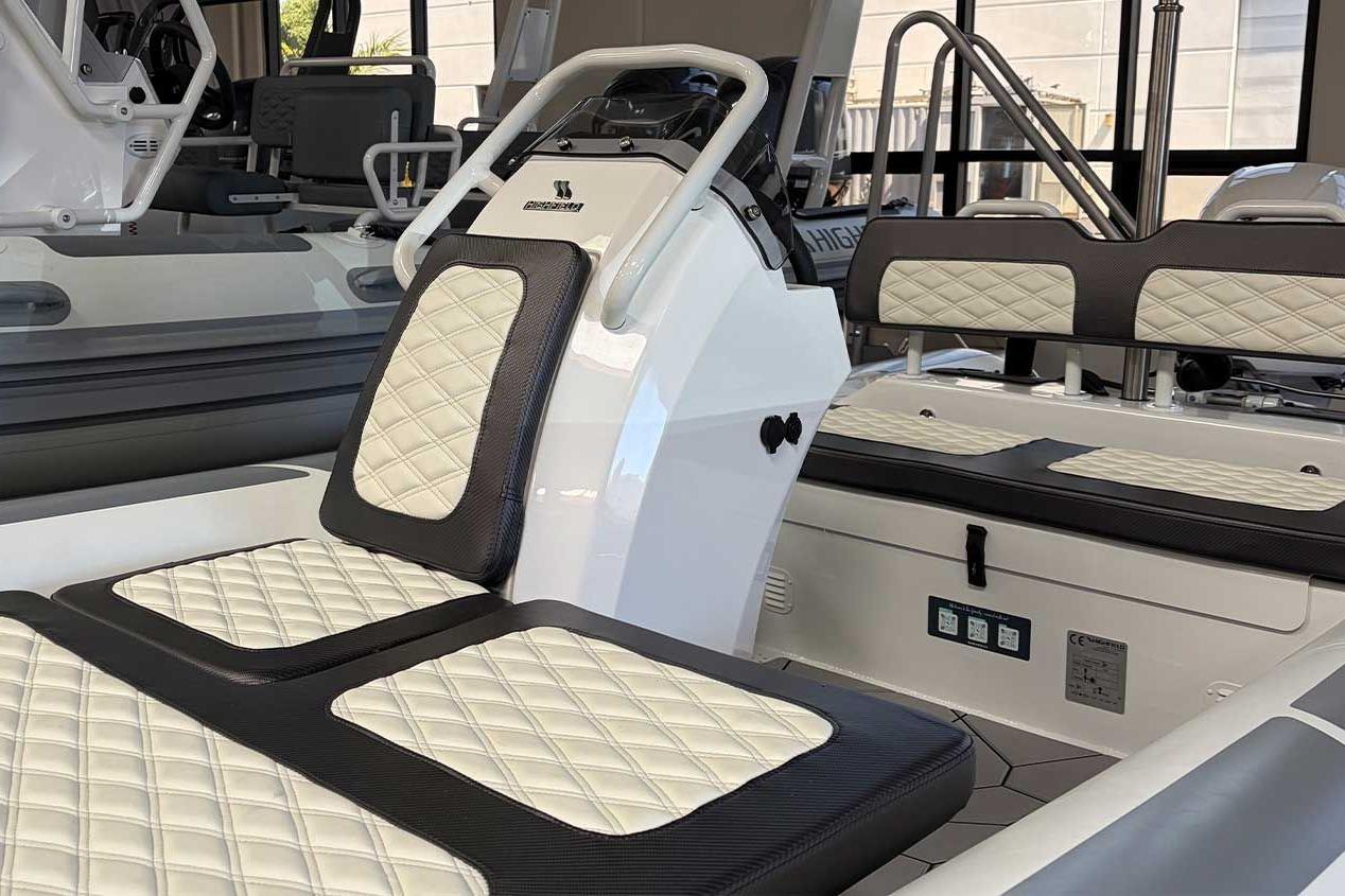 Interior of 2026 Highfield Sport 460 boat with quilted seating and modern design.