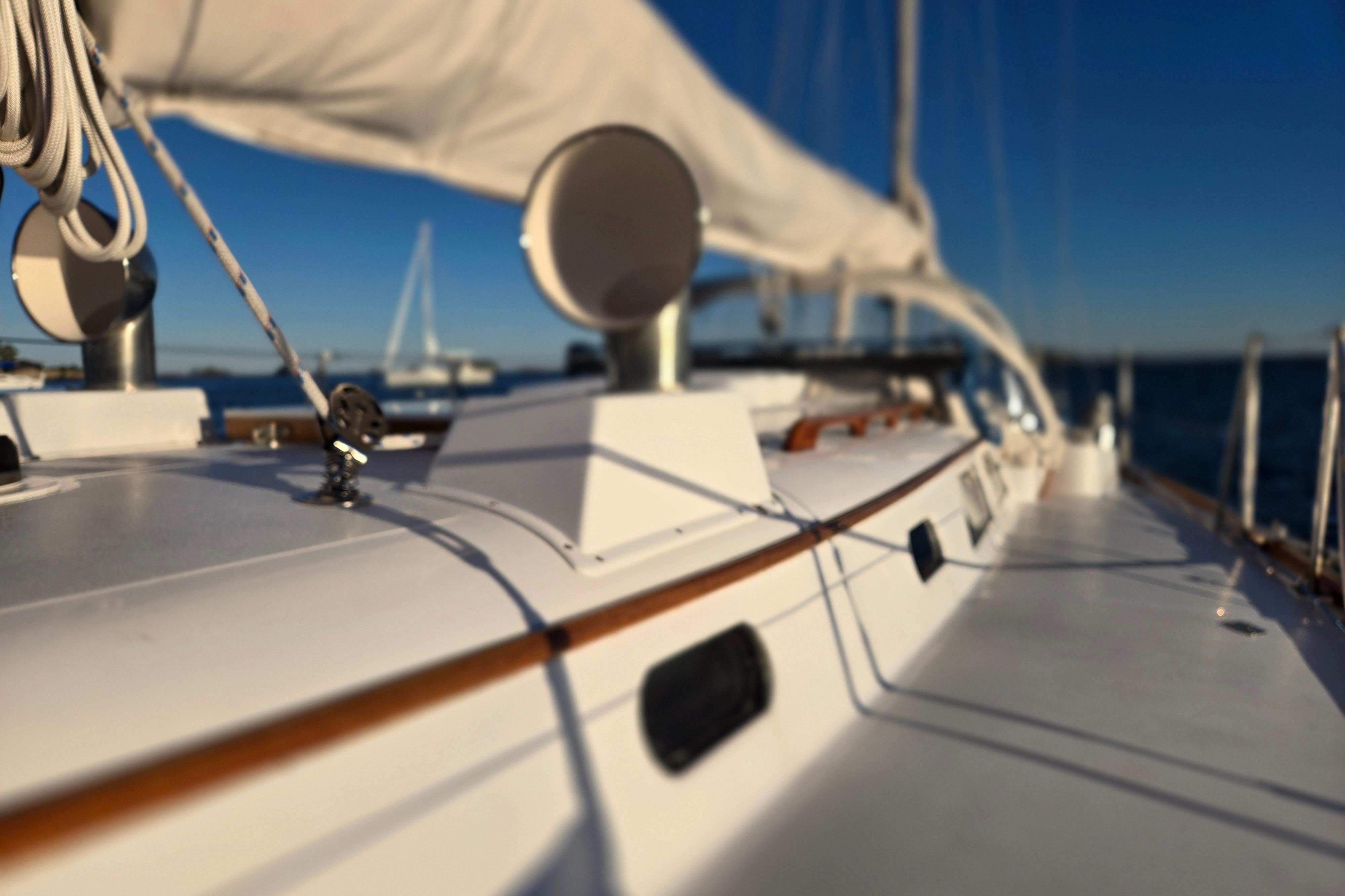 1970 Hinckley Bermuda 40 sailboat deck with rigging, under clear blue sky.