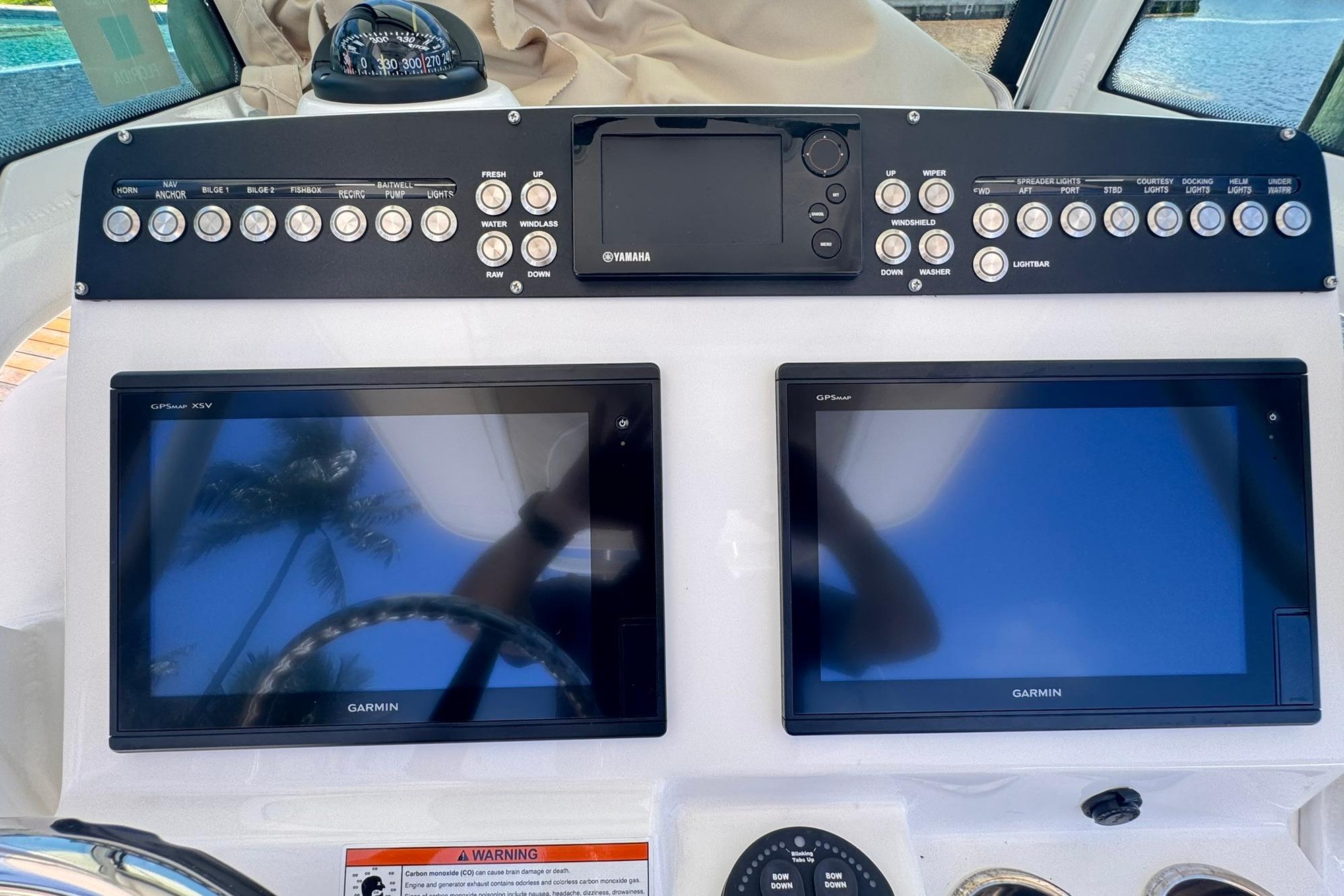 Control panel of 2018 Everglades 253 Center Console with Garmin displays and Yamaha controls.