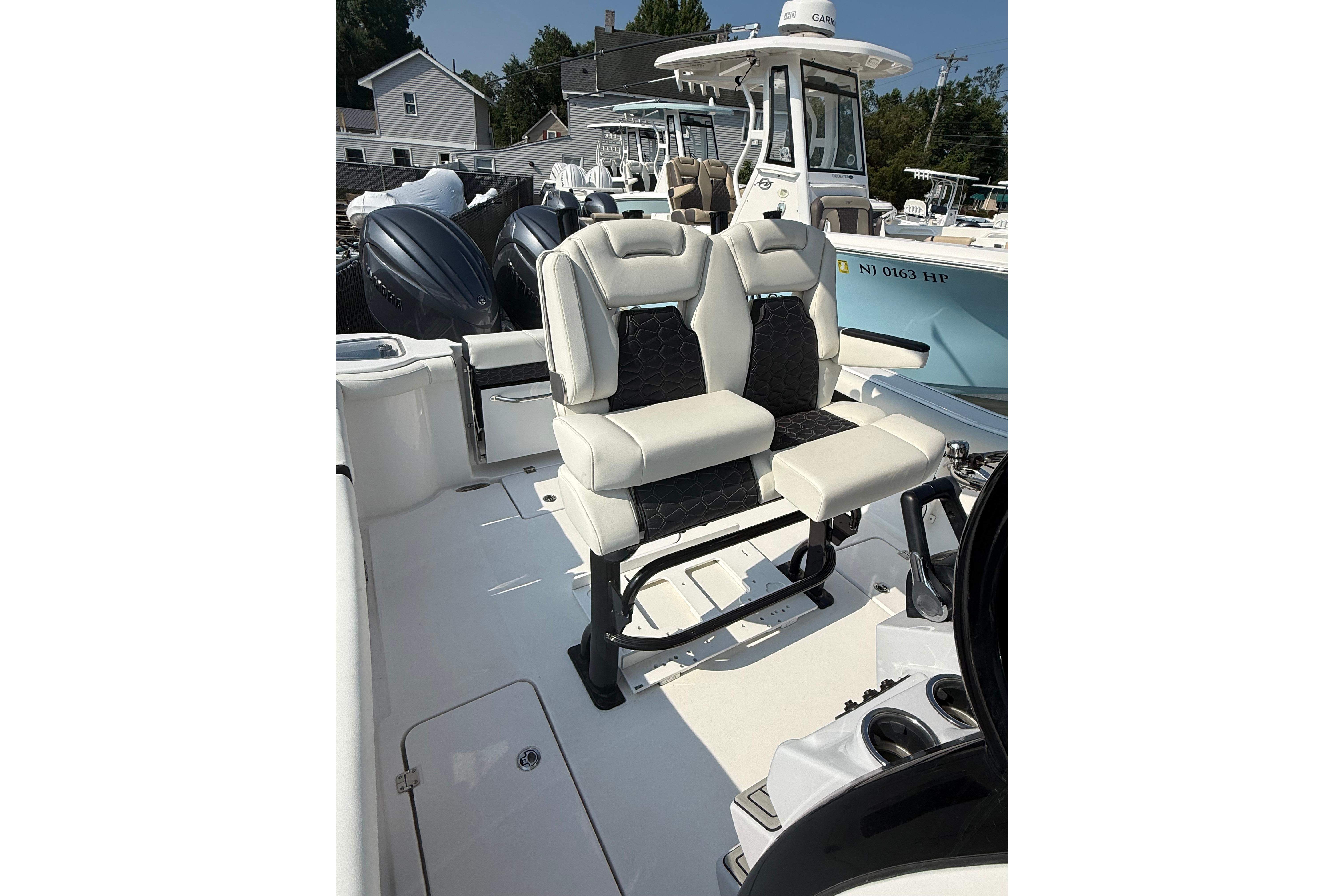 2026 Tidewater 256 CC Adventure boat interior with dual seating and modern design.