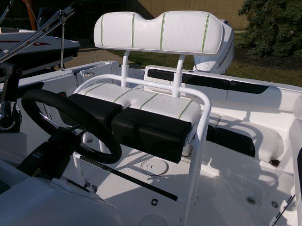 2024 Tahoe 2150 CC boat interior with steering wheel and seating.