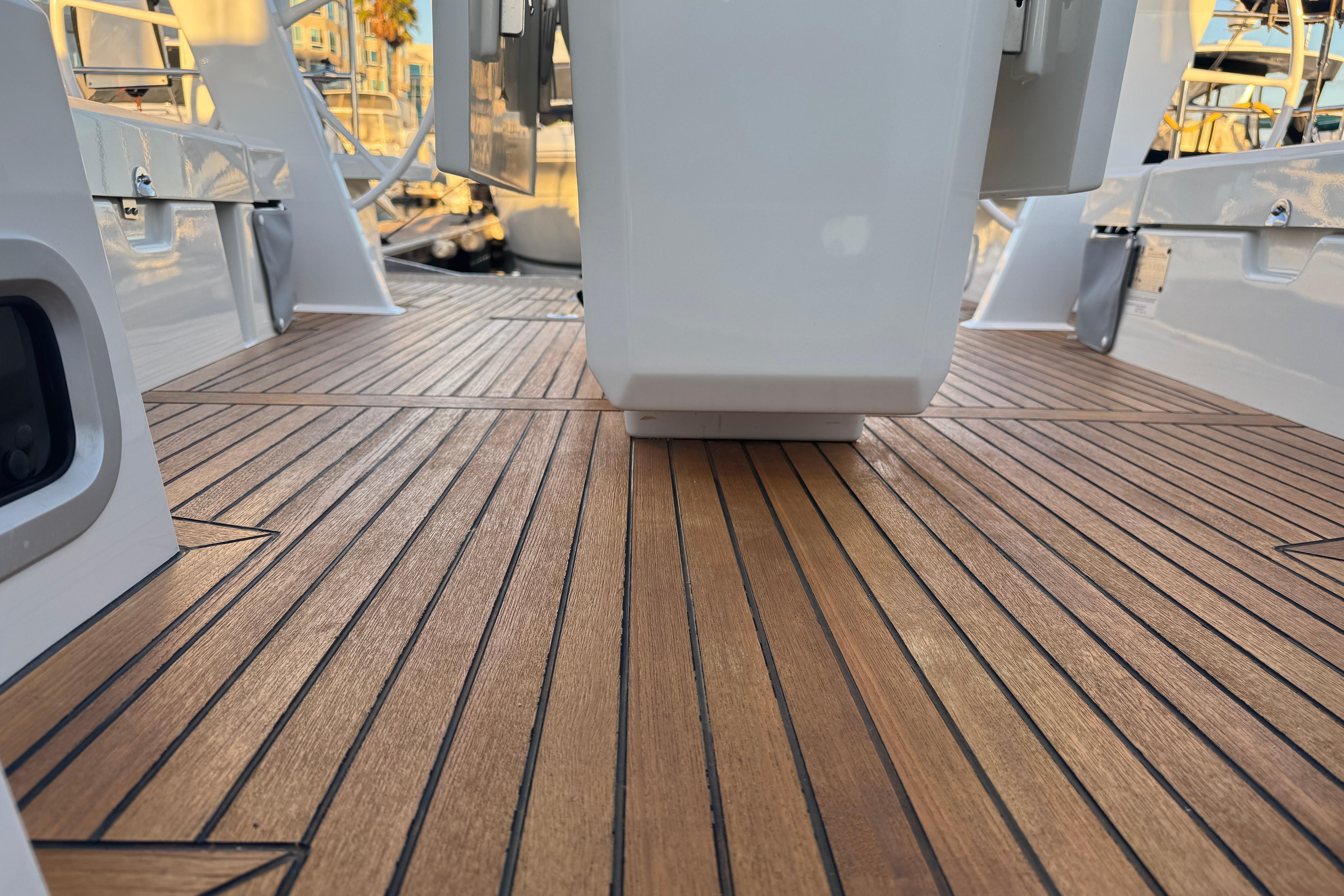 Teak deck of 2023 Beneteau Oceanis 46.1 yacht, showcasing elegant wood finish.