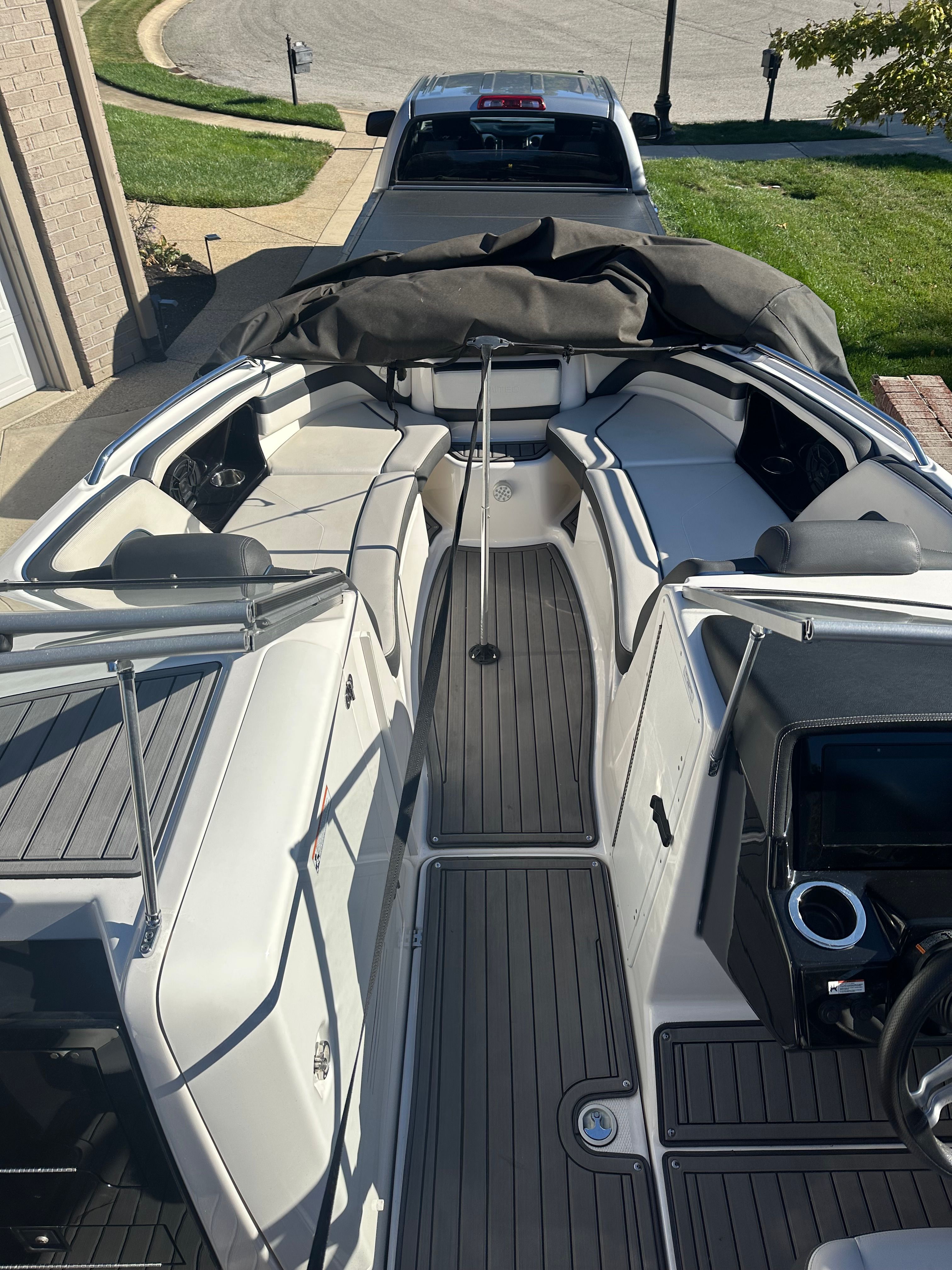 The image shows the interior of a 2018 Yamaha 242 Limited S boat with gray seating.