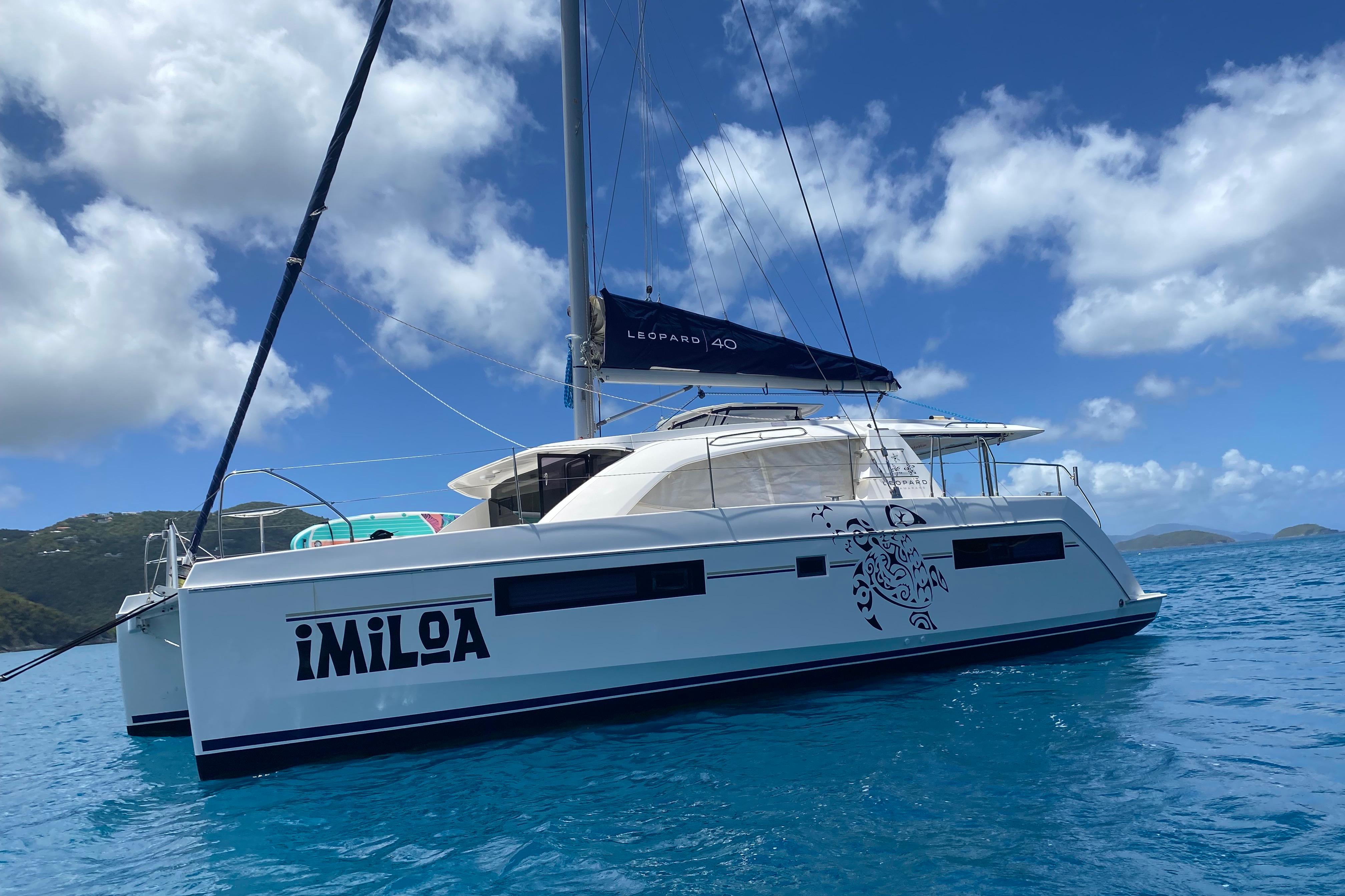 2017 Leopard 40 catamaran sailing on clear blue waters under a bright sky.