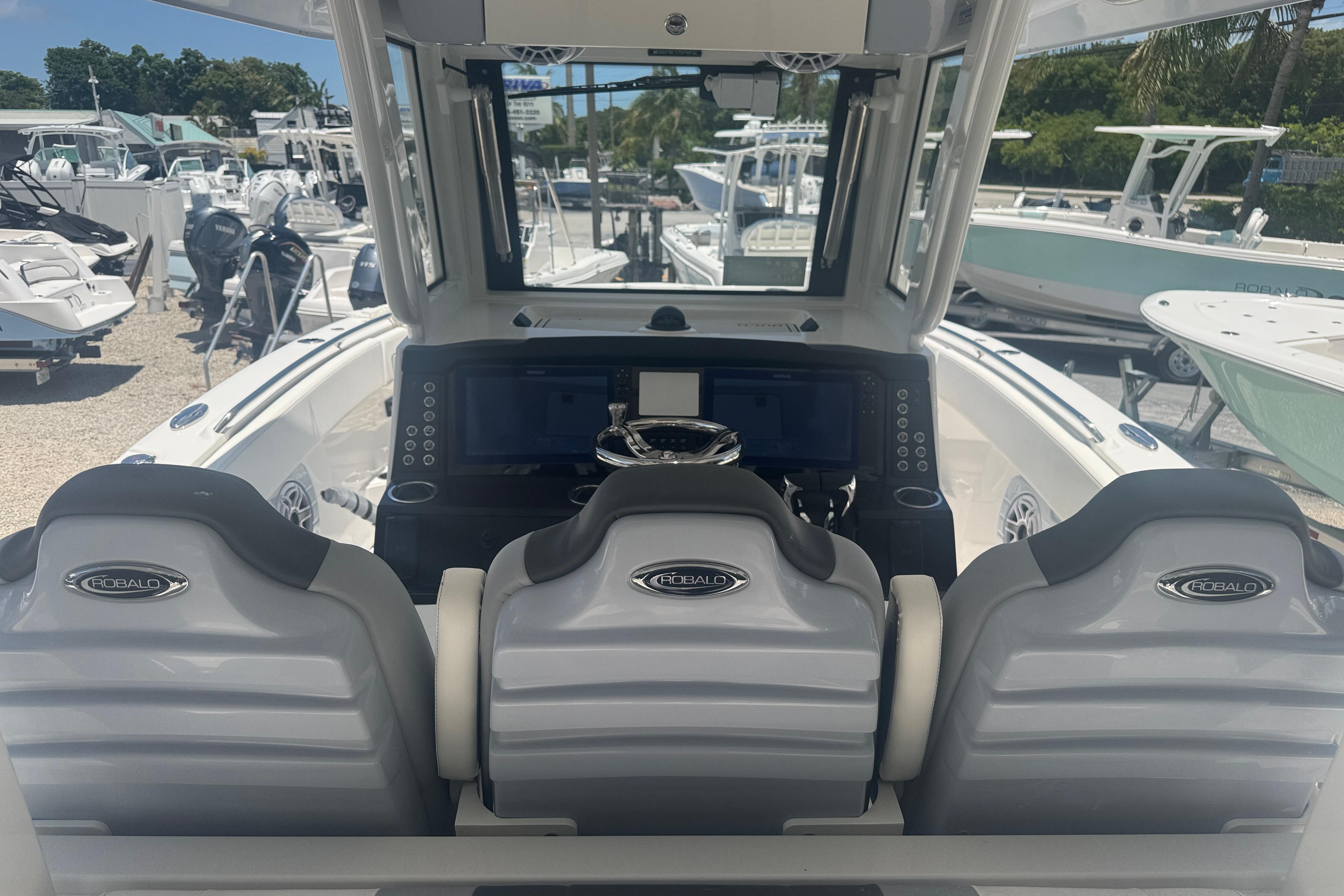 2025 Robalo R300 Center Console boat interior with modern dashboard and seating.