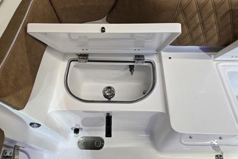 2026 Sea Hunt Ultra 275 Coffin Box interior with open storage compartment.