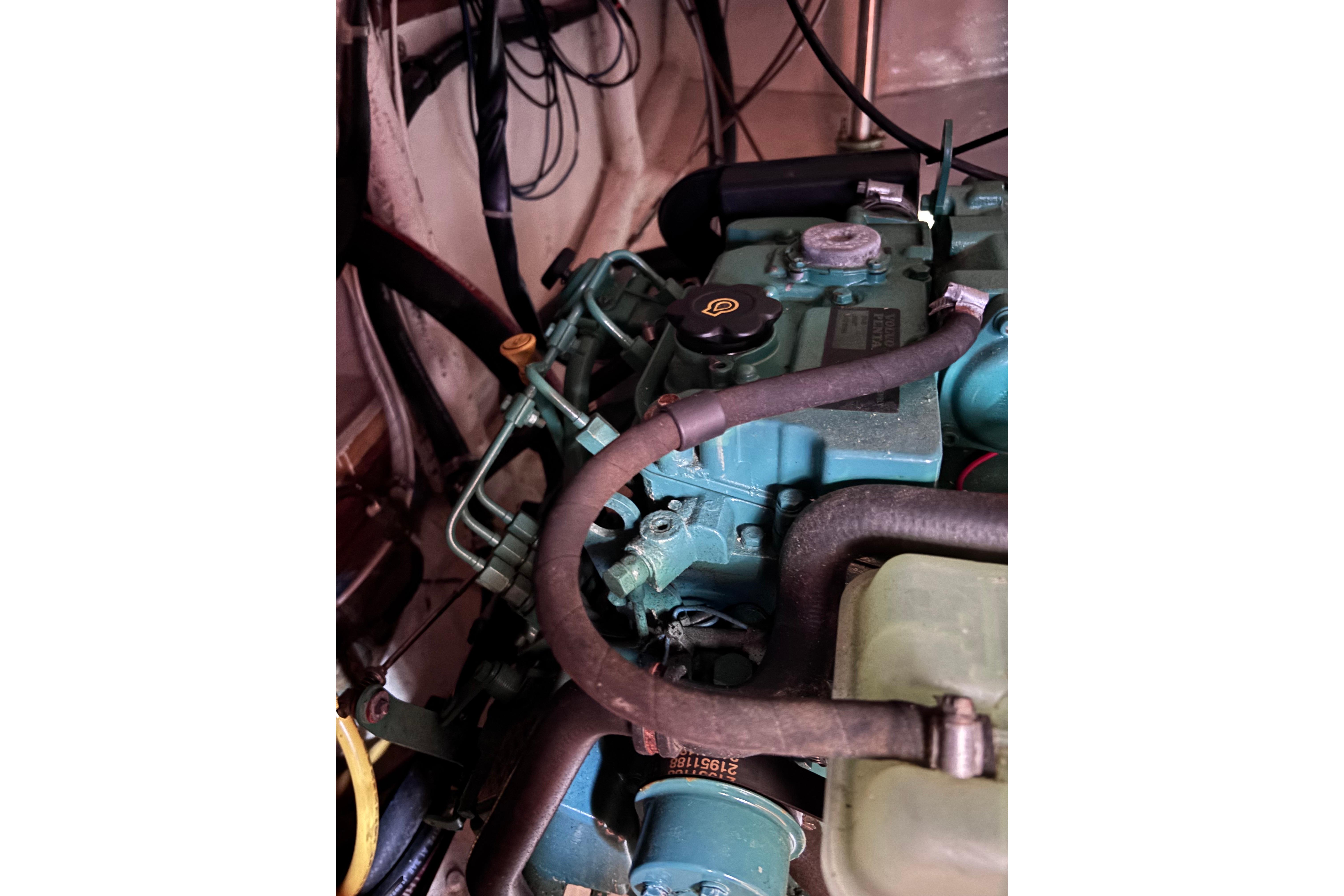 1978 Swift 33 engine compartment with visible hoses and components.