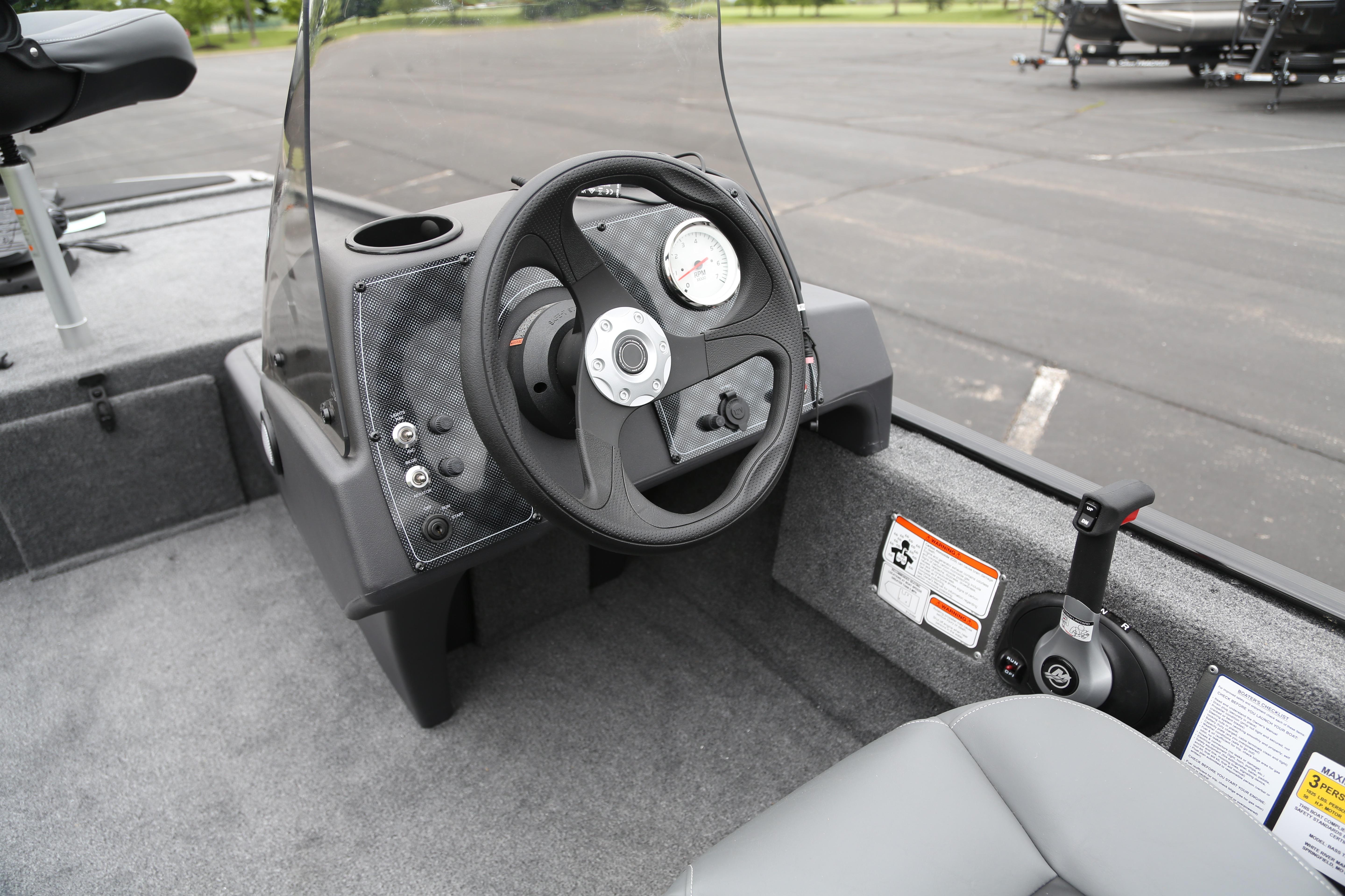 2026 Tracker Bass Tracker Classic XL boat cockpit with steering wheel and controls.