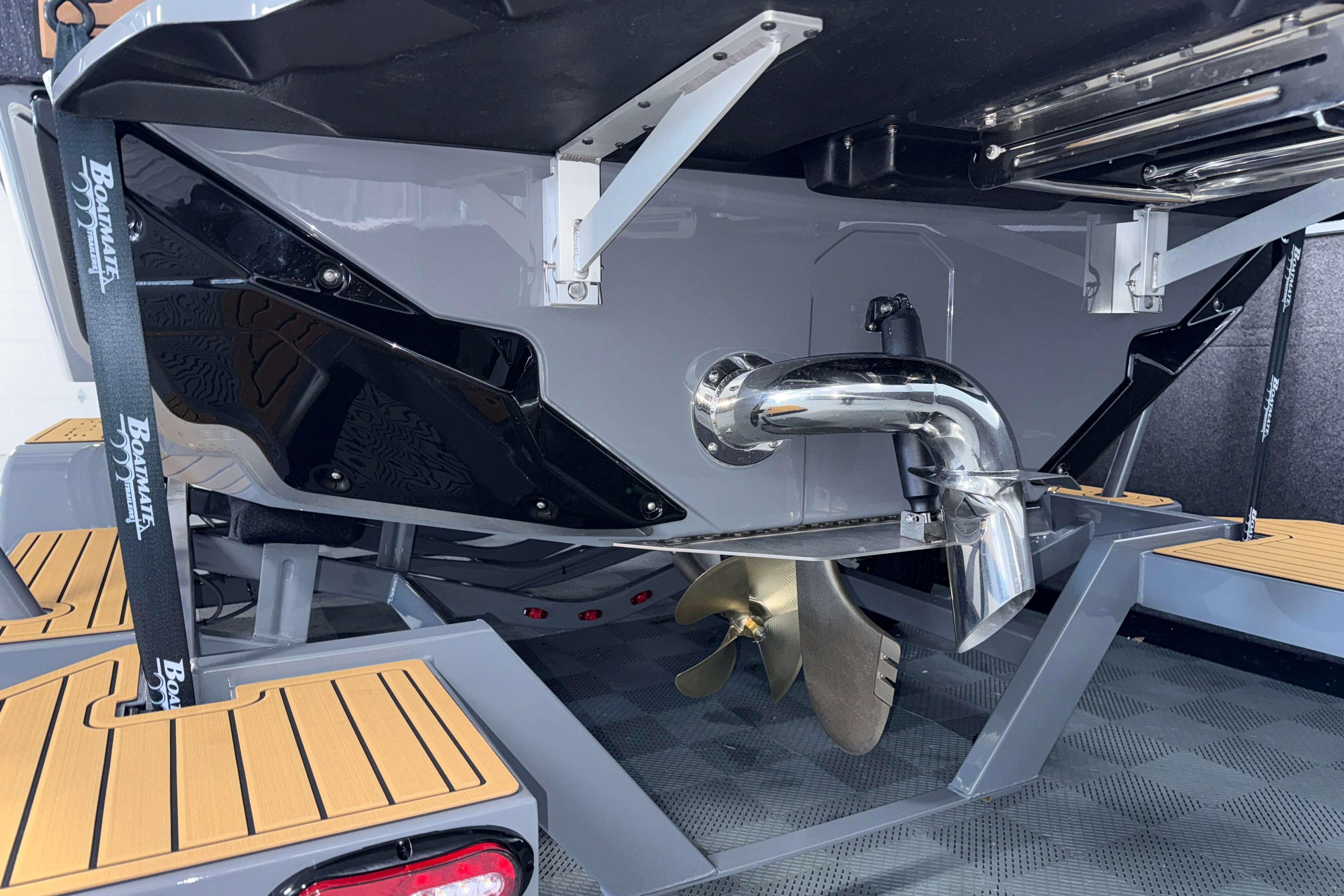 2026 Nautique Super Air Nautique GS22 boat stern with propeller and exhaust system.