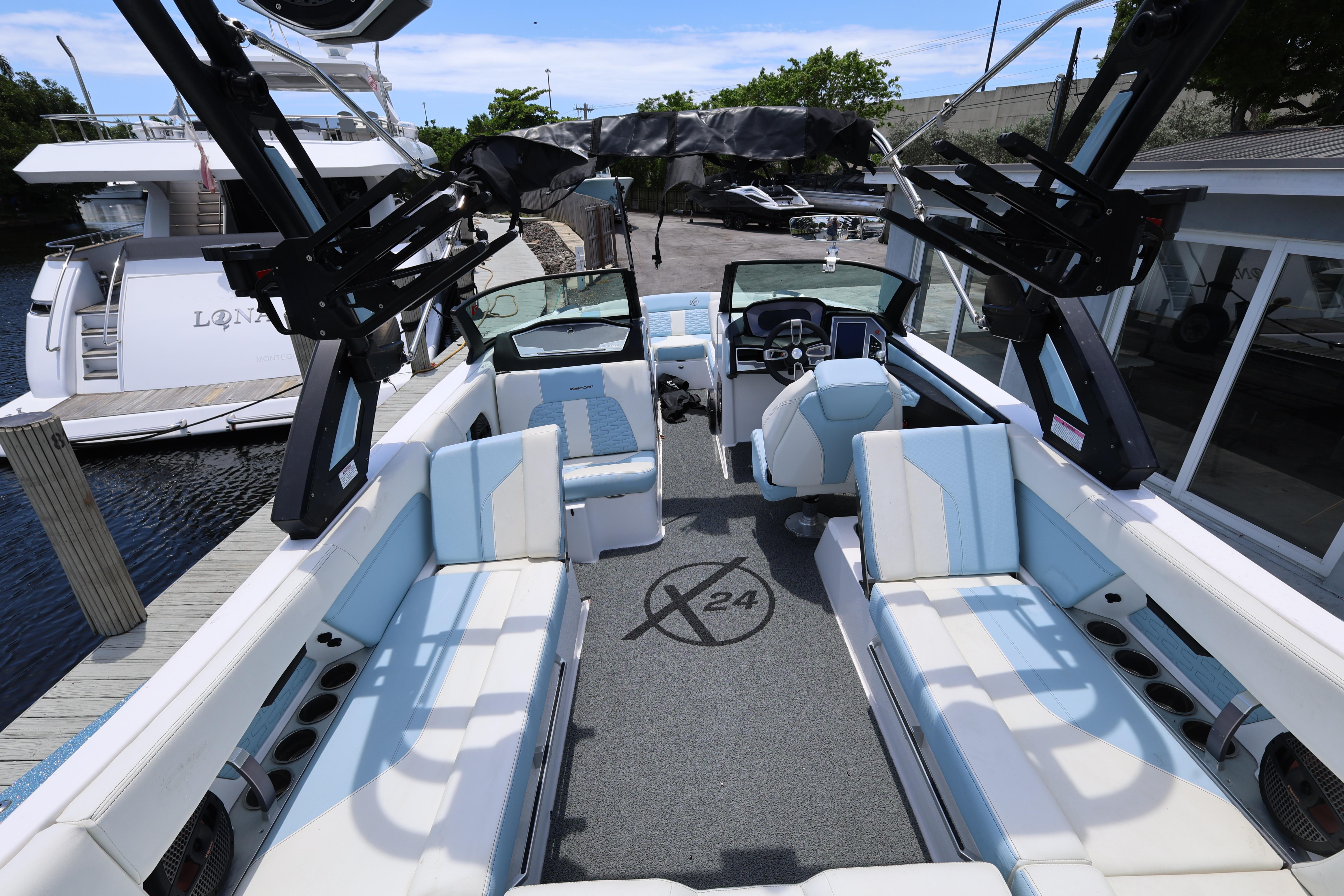 2023 MasterCraft X24 boat interior with luxurious seating and advanced controls.