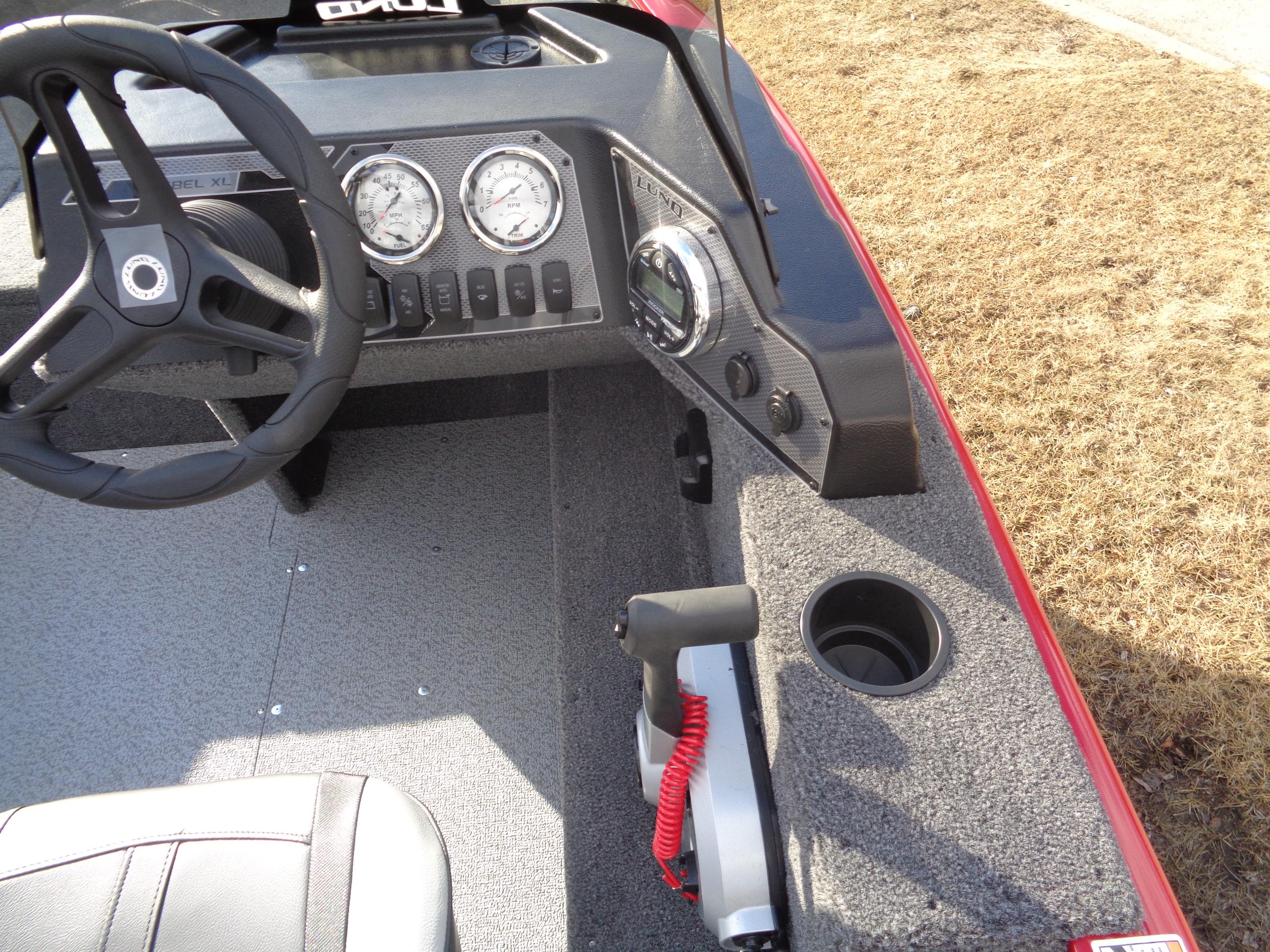2025 Lund 1650 Rebel XL SS boat dashboard with steering wheel and control panel.