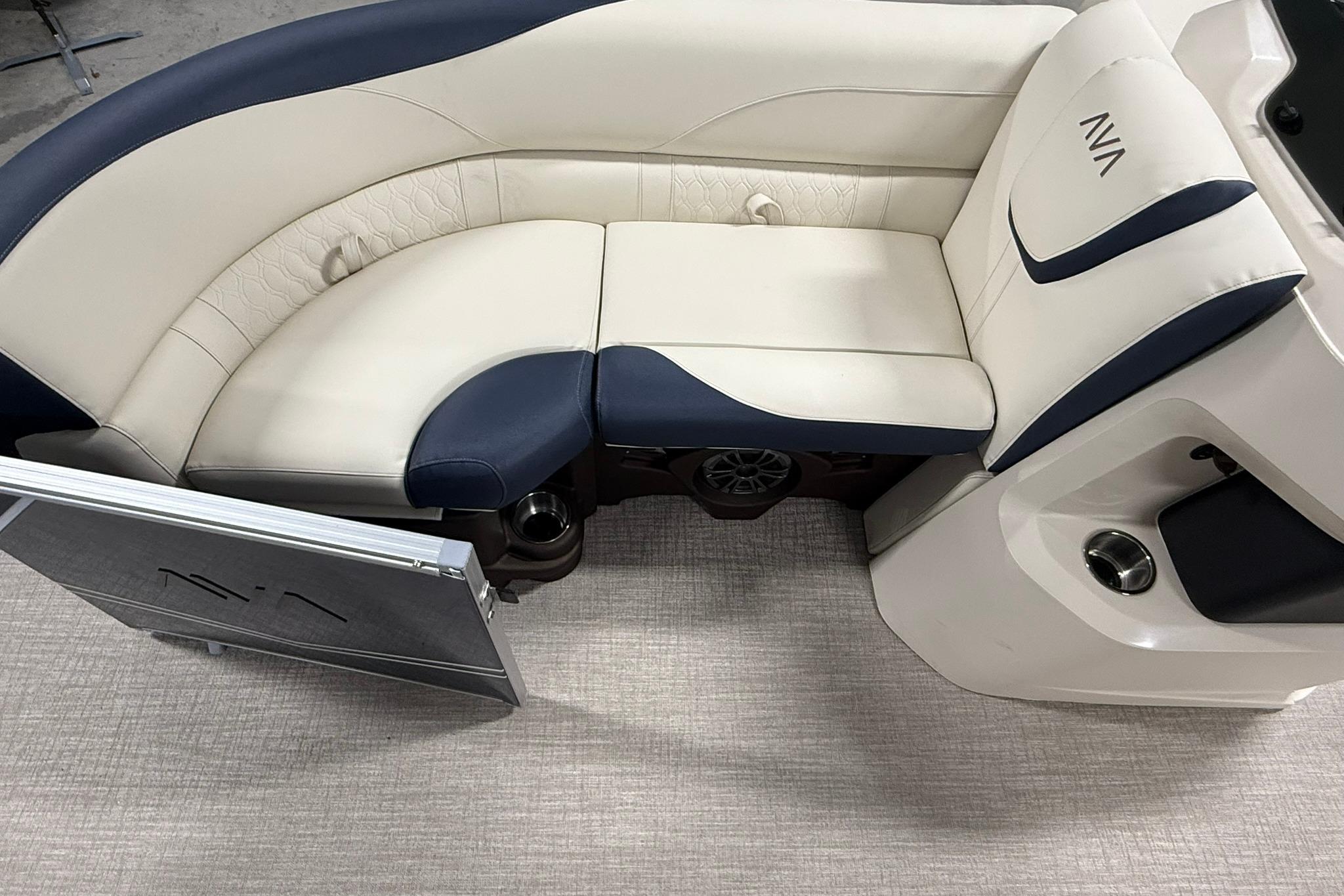 Luxurious seating in 2026 Avalon LSZ Elite 21' boat, featuring cream and navy upholstery.