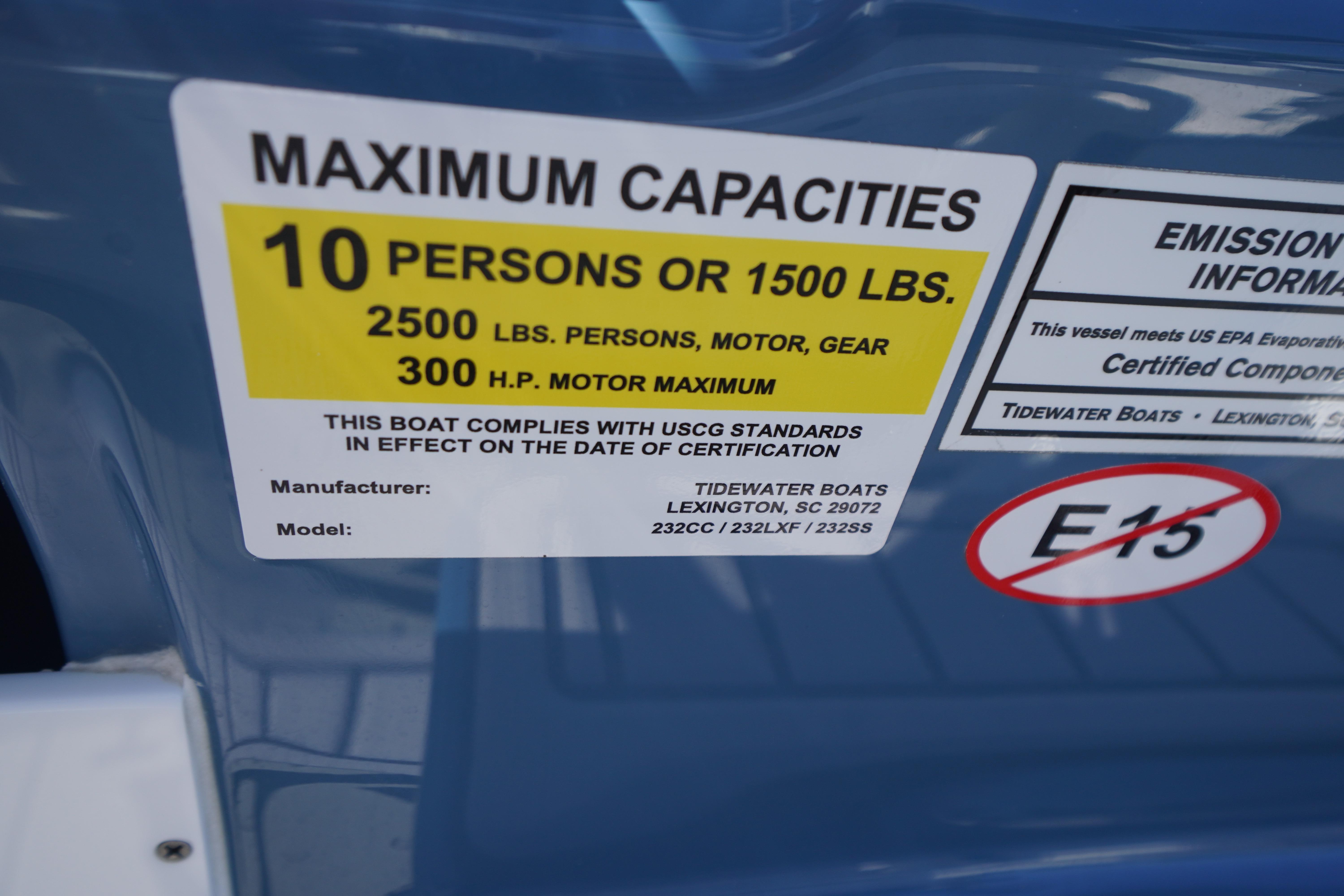 Label on 2025 Tidewater 232 SS boat showing maximum capacities and emission information.