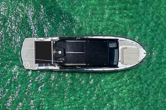 Top view of 2025 NX Boats NX41 HORIZON on clear turquoise water.