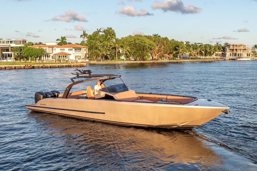 Luxury DeKoning 43 yacht cruising on a sunny day, 2023 model.