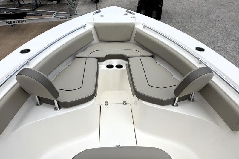 2024 Key West 239 FS boat interior with cushioned seating and cup holders.
