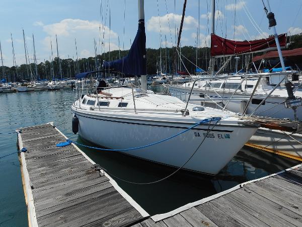 1984 Catalina 30 sailboat docked in a marina.