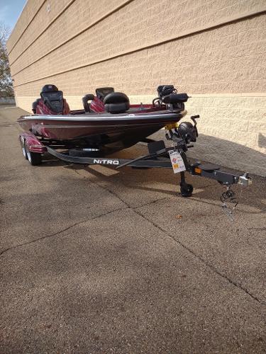 2024 Nitro Z21 XL boat on trailer, parked outdoors.