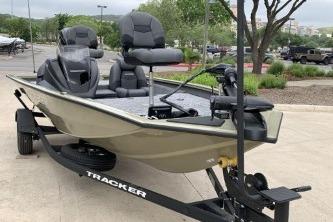 2026 Tracker Pro Team 175 fishing boat on trailer, parked outdoors.