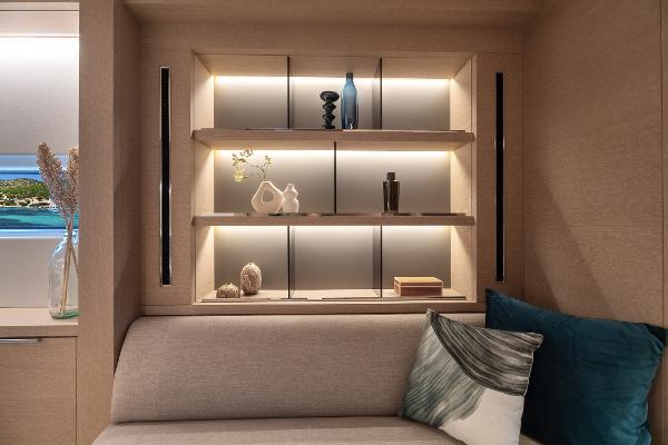 Luxurious interior of 2025 Lagoon SIXTY 5 yacht with elegant shelving and decor.