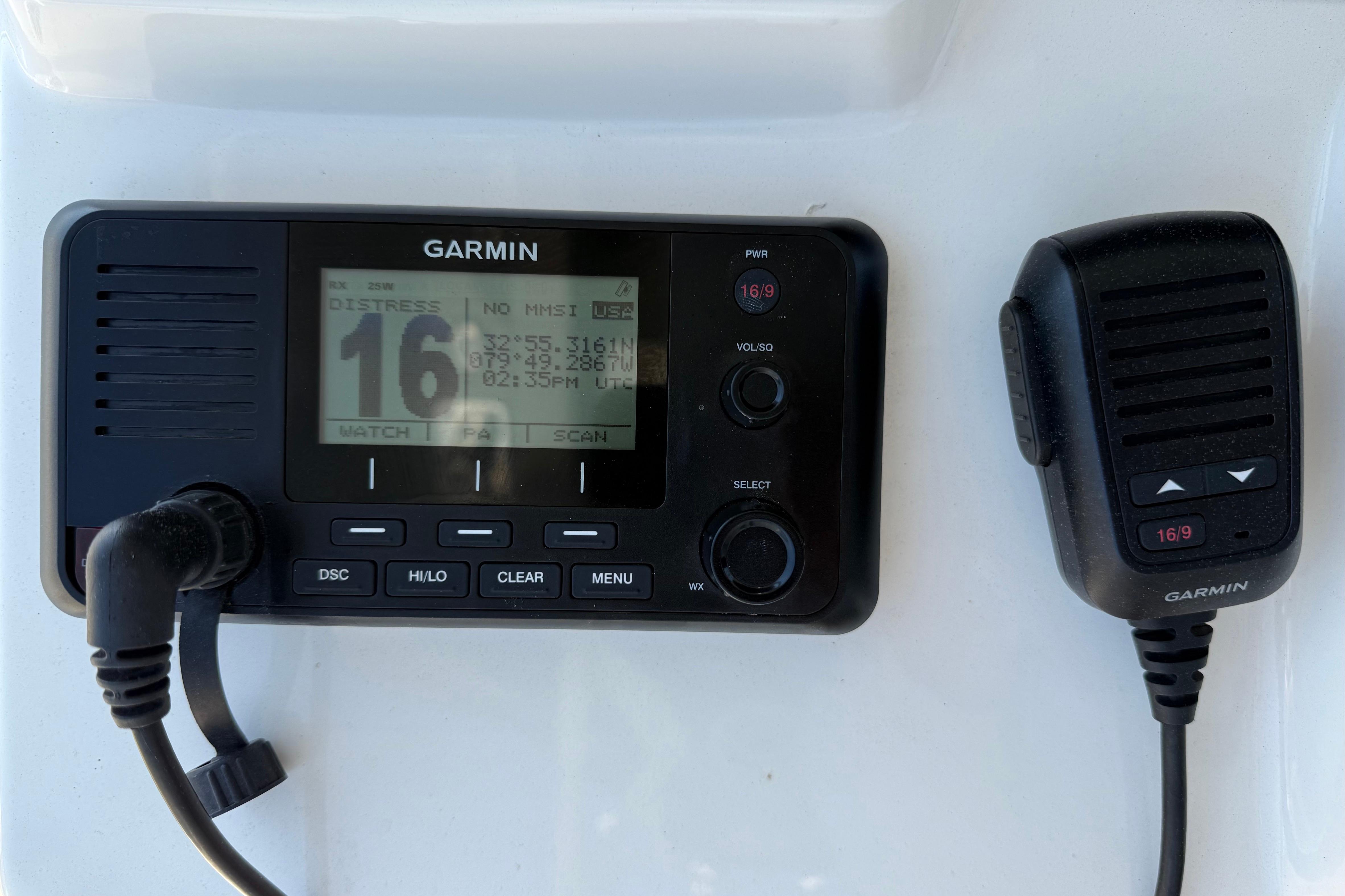Garmin marine radio on 2023 Cobia 350 Center Console boat dashboard.