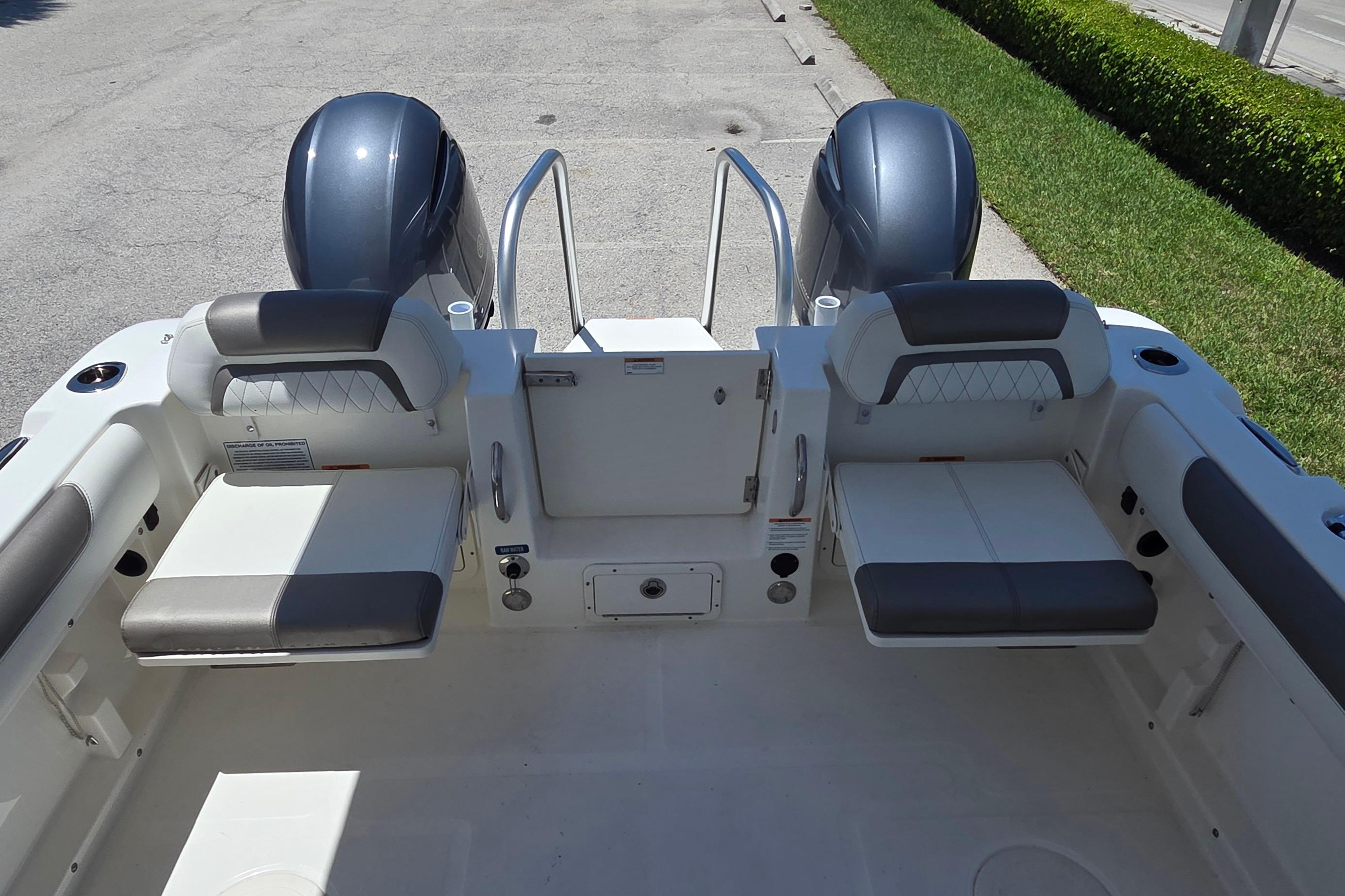 2022 World Cat 255 DC boat interior with dual seating and twin engines.