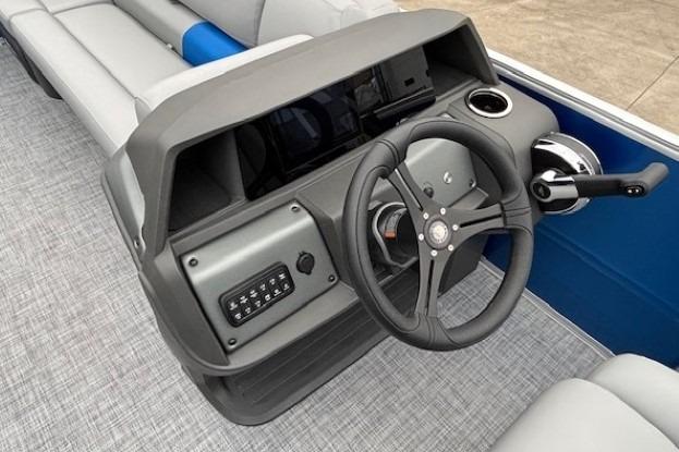 2026 Sun Tracker Party Barge 20 DLX steering console with modern controls and seating.