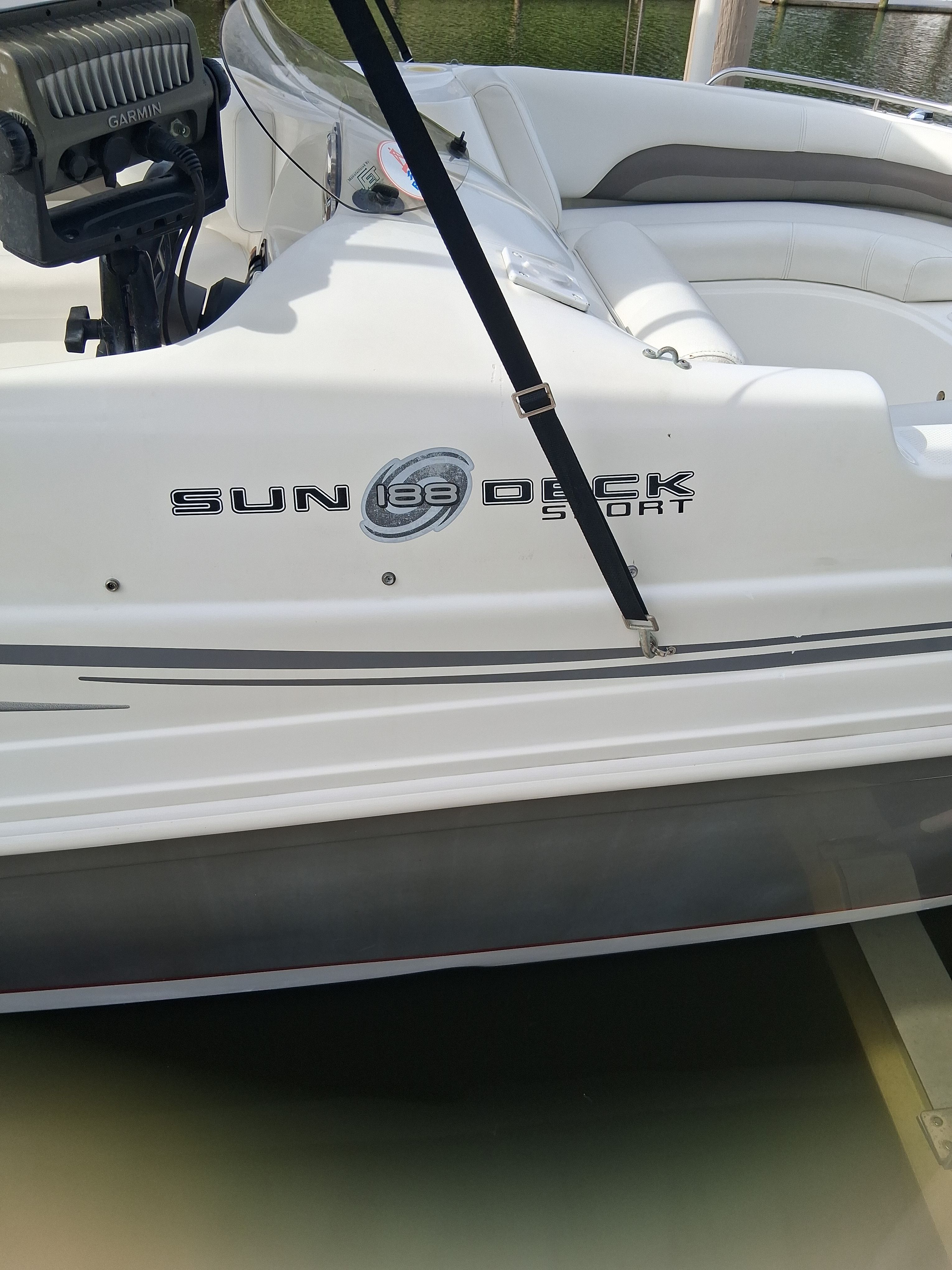 2013 Hurricane 188SD Sun Deck Sport boat at dock.