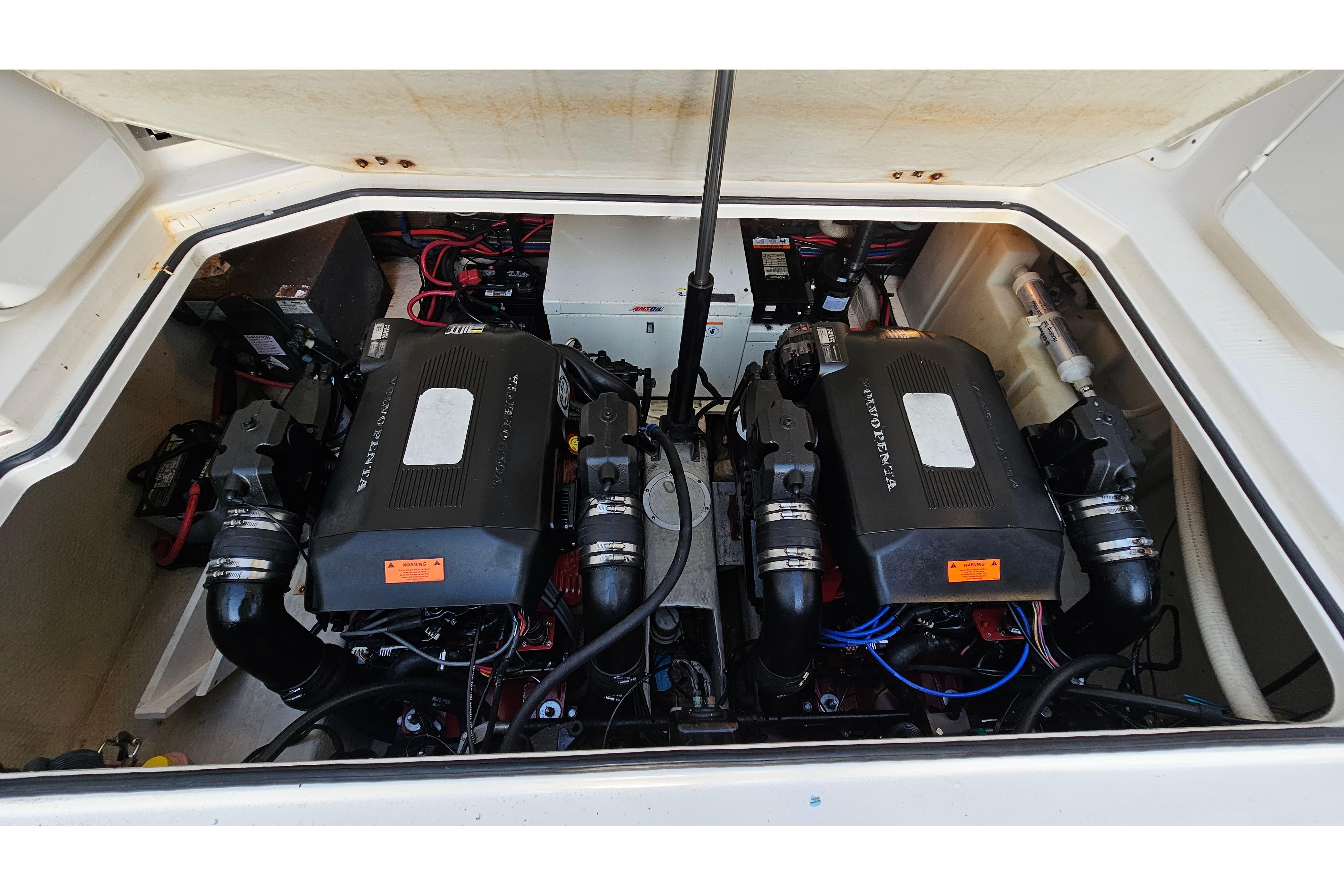 Engine compartment of a 2005 Regal 3060 Window Express boat, featuring dual Volvo Penta engines.