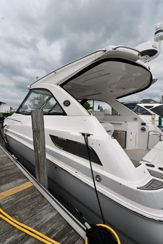 2021 Regal 35 Sport Coupe docked, showcasing sleek design and modern features.