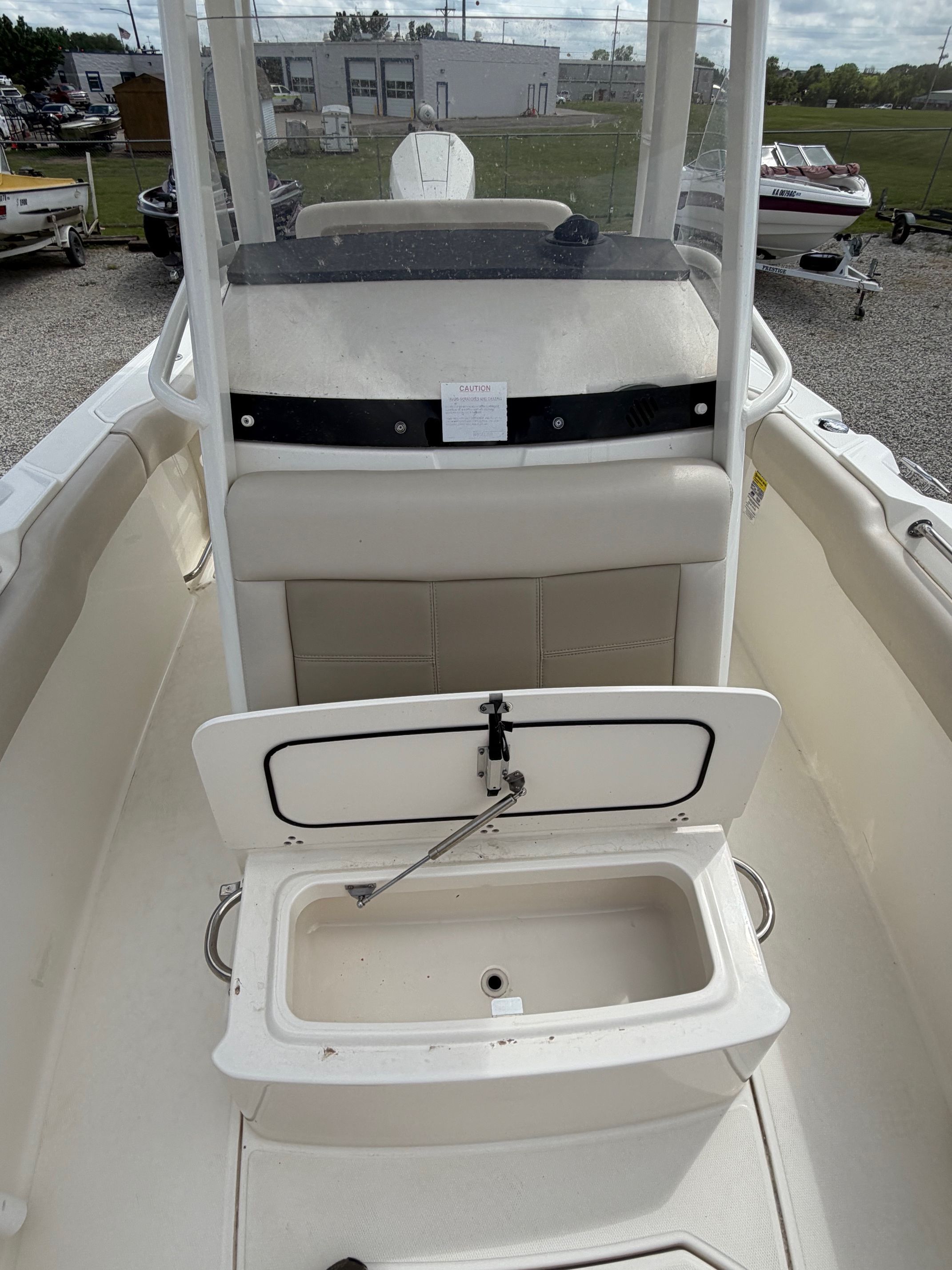 Boston Whaler 230 Outrage 2020 with open storage compartment.