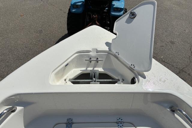 2026 Key West 189 FS boat with open storage compartment on deck.