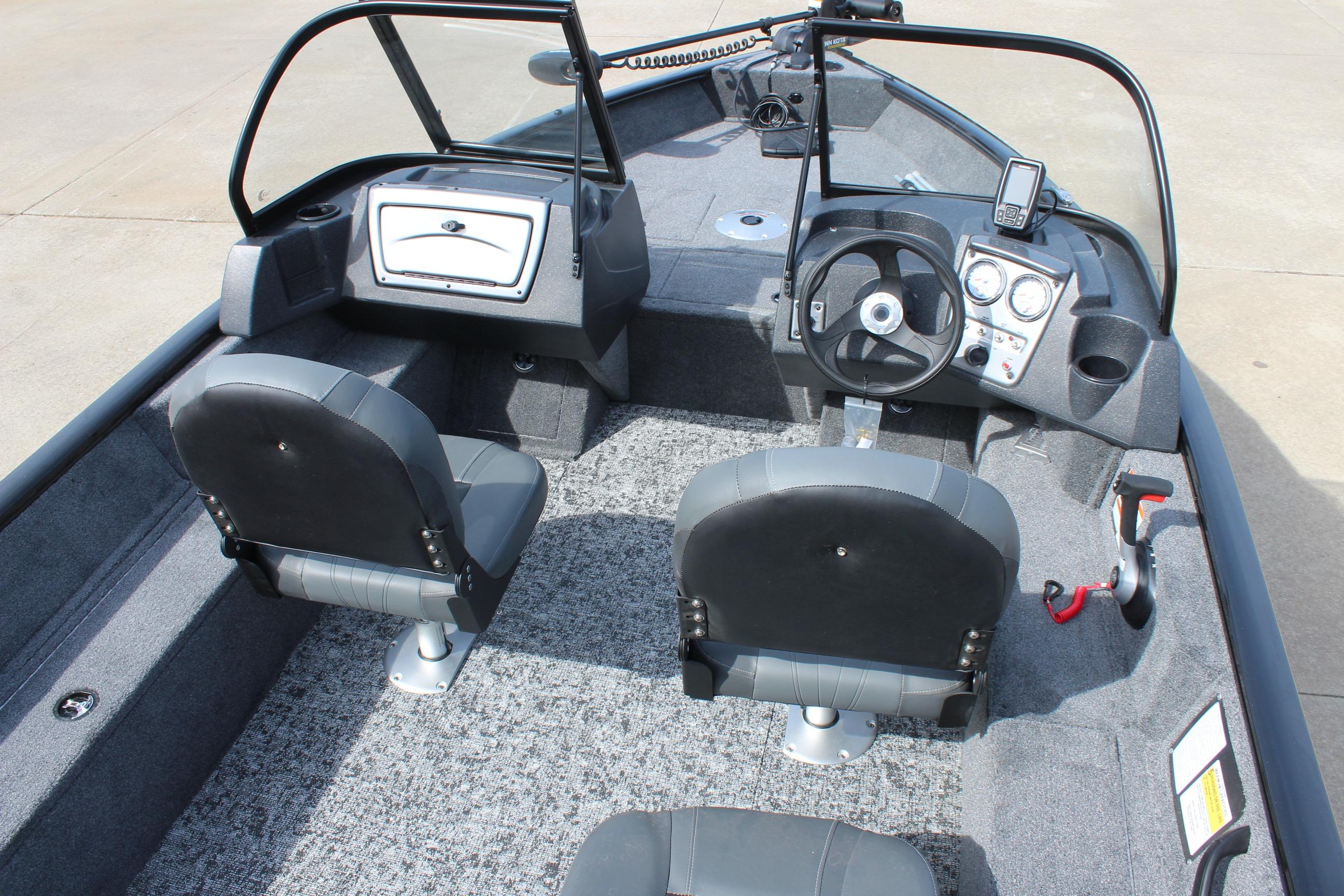 Interior view of 2026 Tracker Targa V-18 Combo boat with dual seats and steering console.