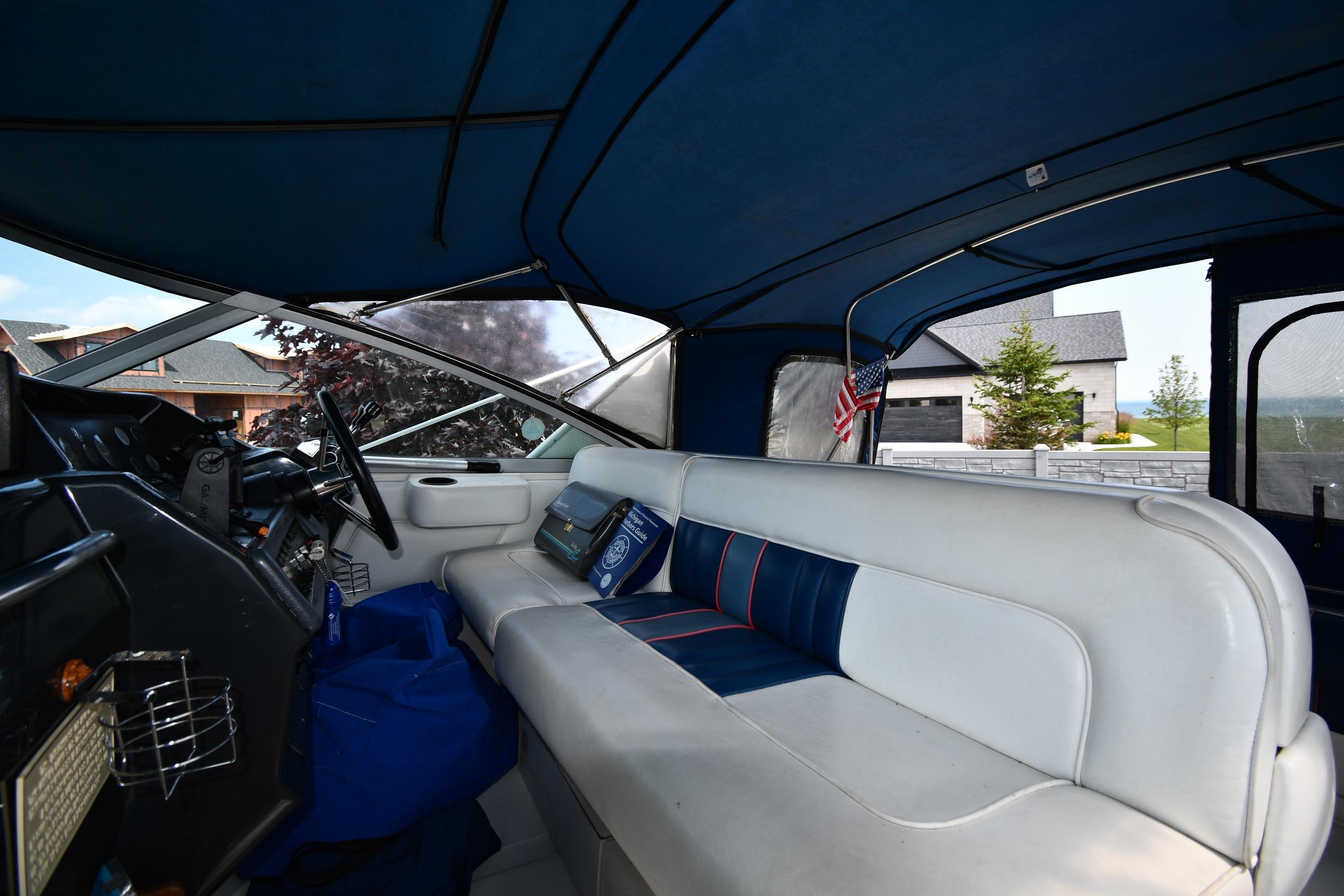 Interior of a 1993 Sea Ray 300 Sundancer boat with blue and white seating.