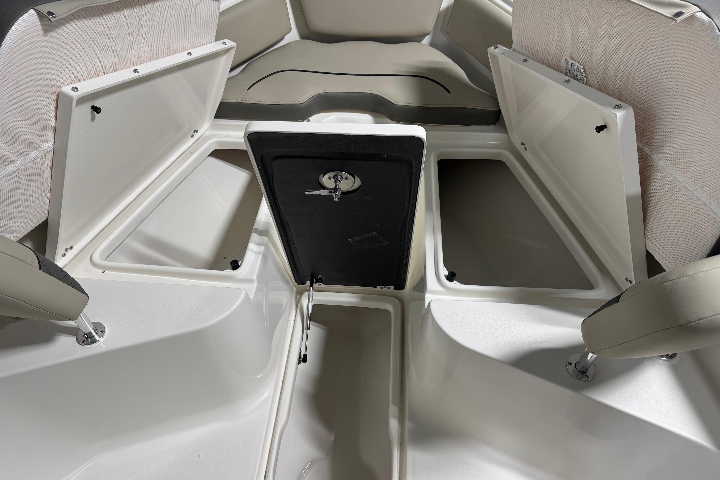 2026 Key West 239 FS boat interior with open storage compartments.