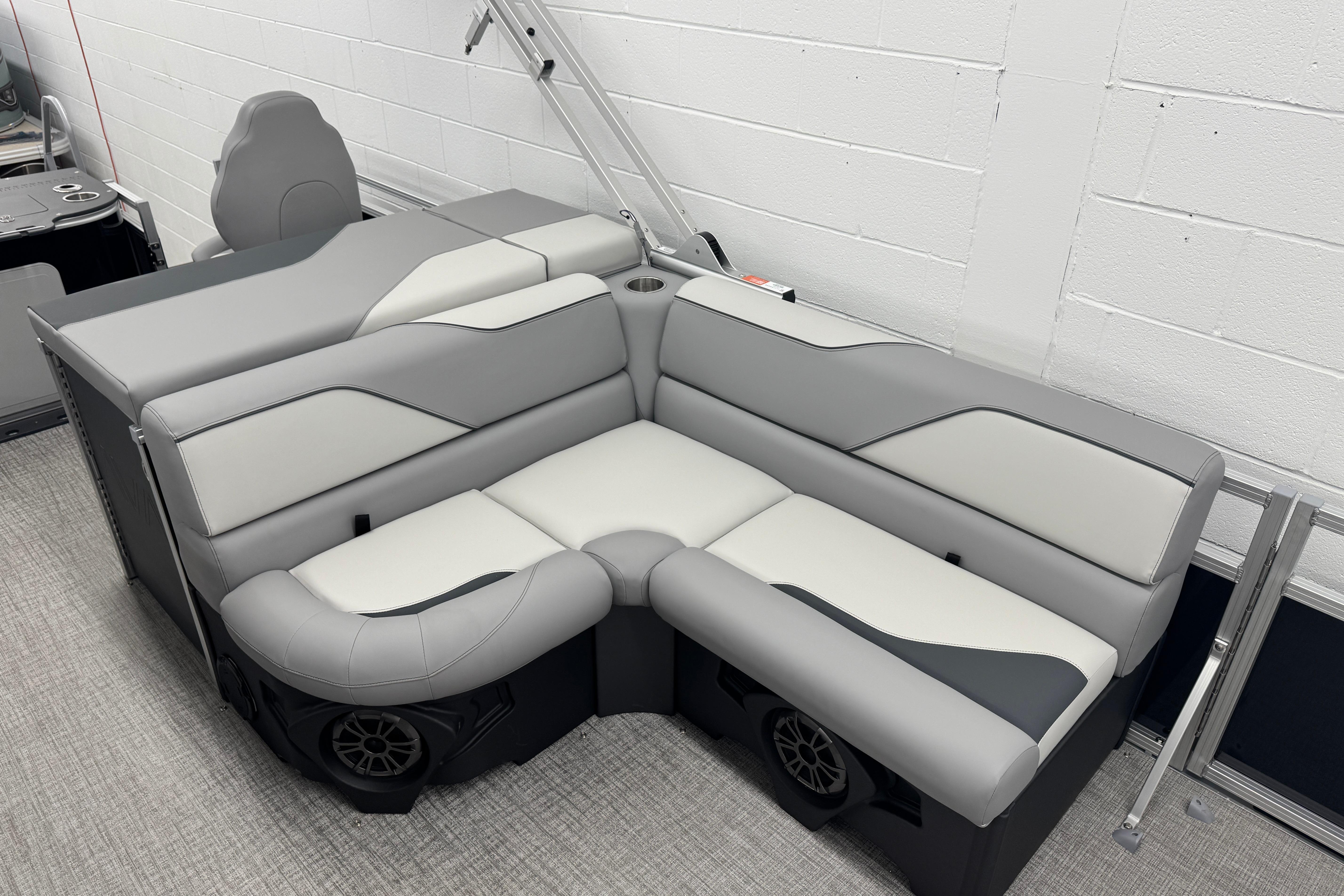 2026 Avalon Ventue 85 RF boat interior with modern gray seating and integrated speakers.