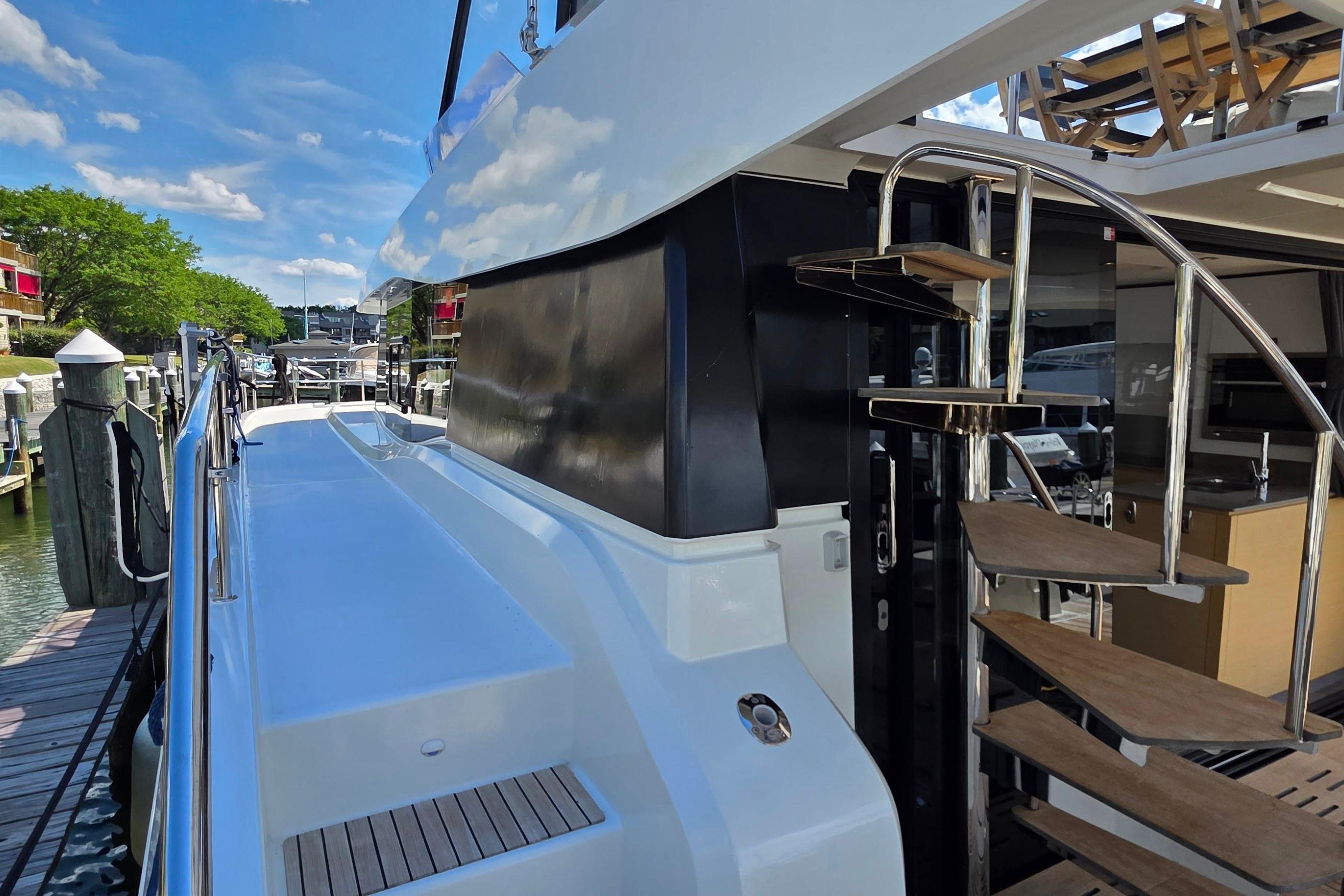 2018 Fountaine Pajot Motor Yacht 44 with sleek deck and spiral staircase.