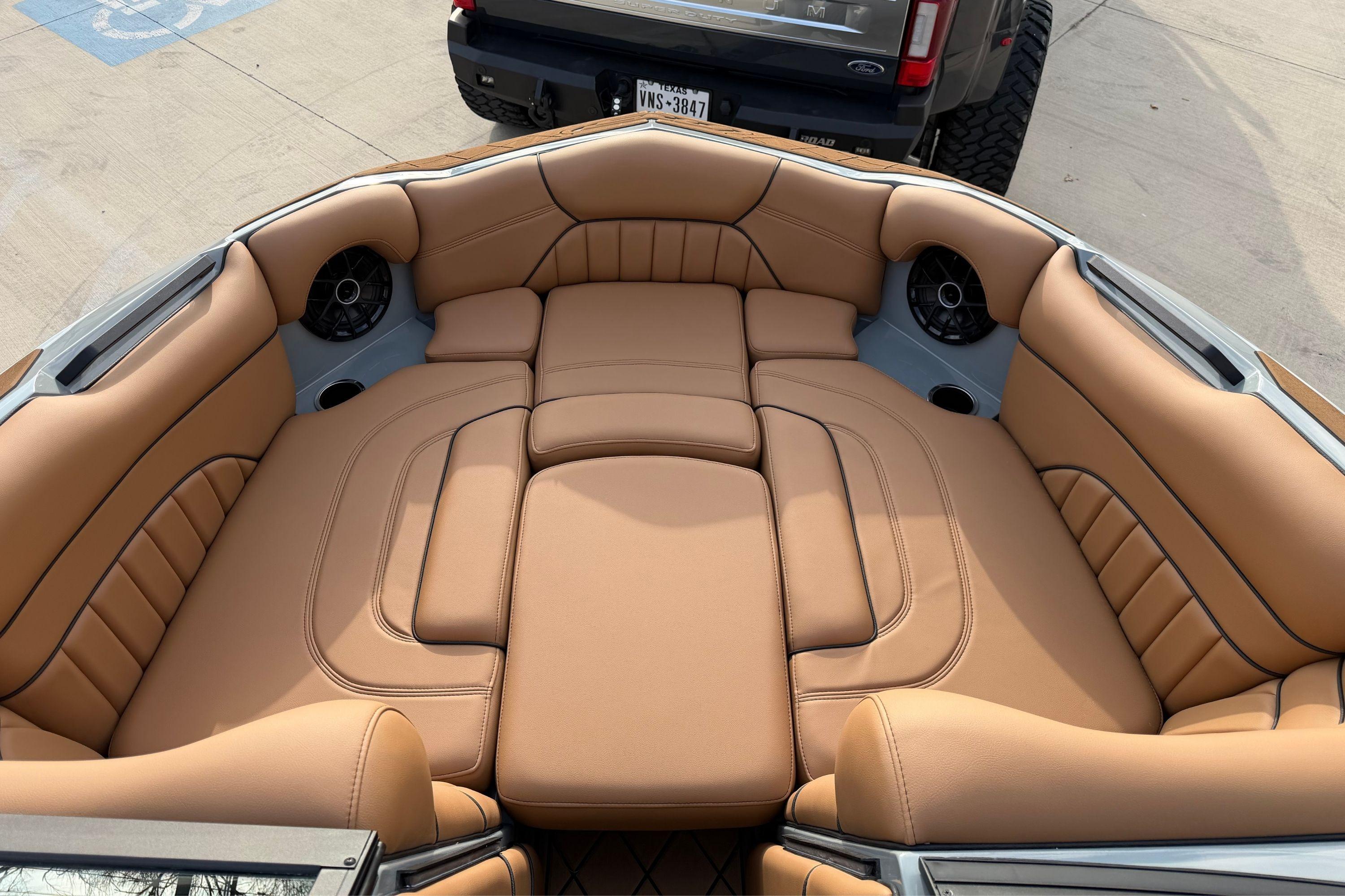 Luxurious tan leather seating in 2026 MB B52 21 Alpha boat interior.