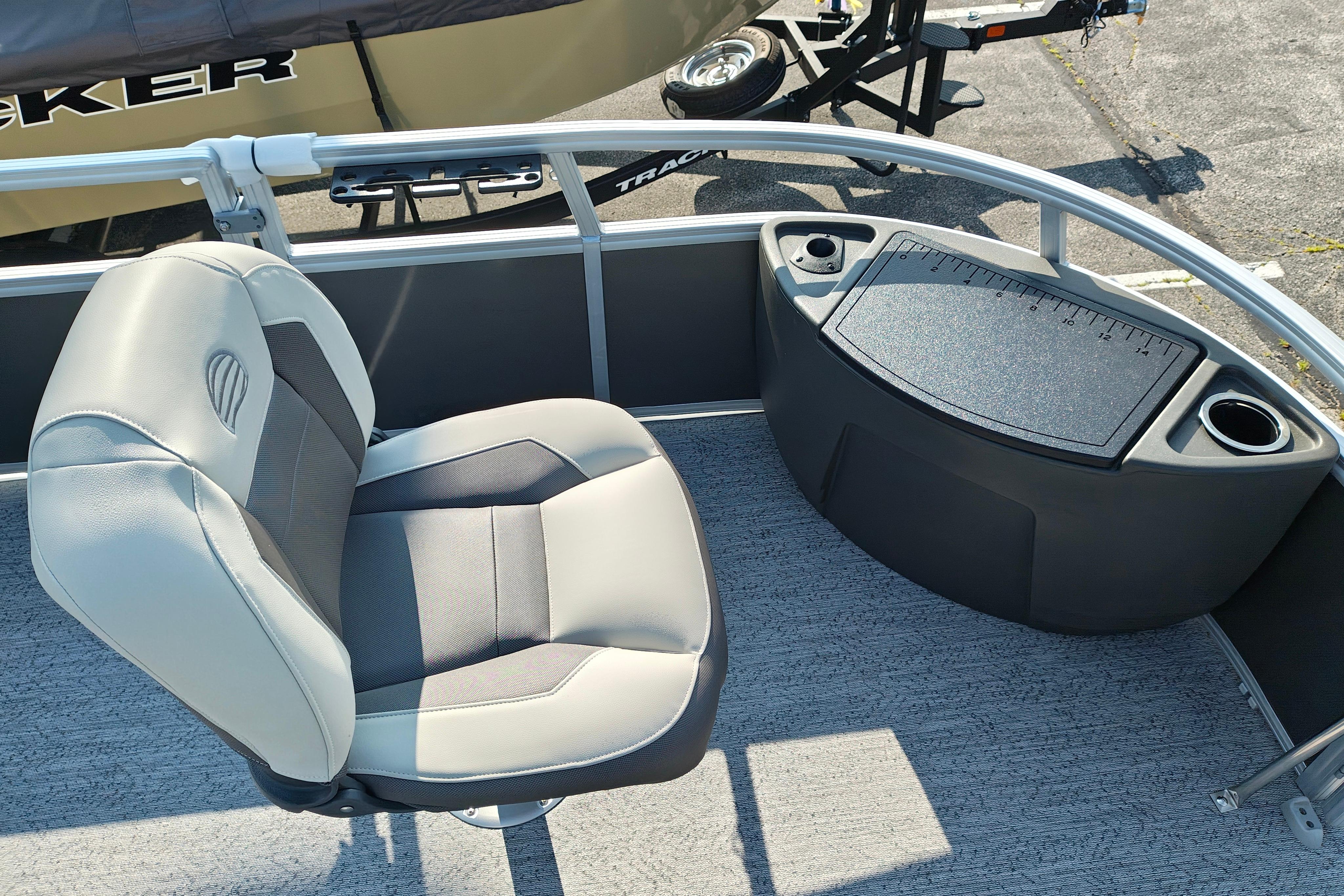 2026 Sun Tracker Bass Buggy 18 DLX boat seat and console with cup holders.