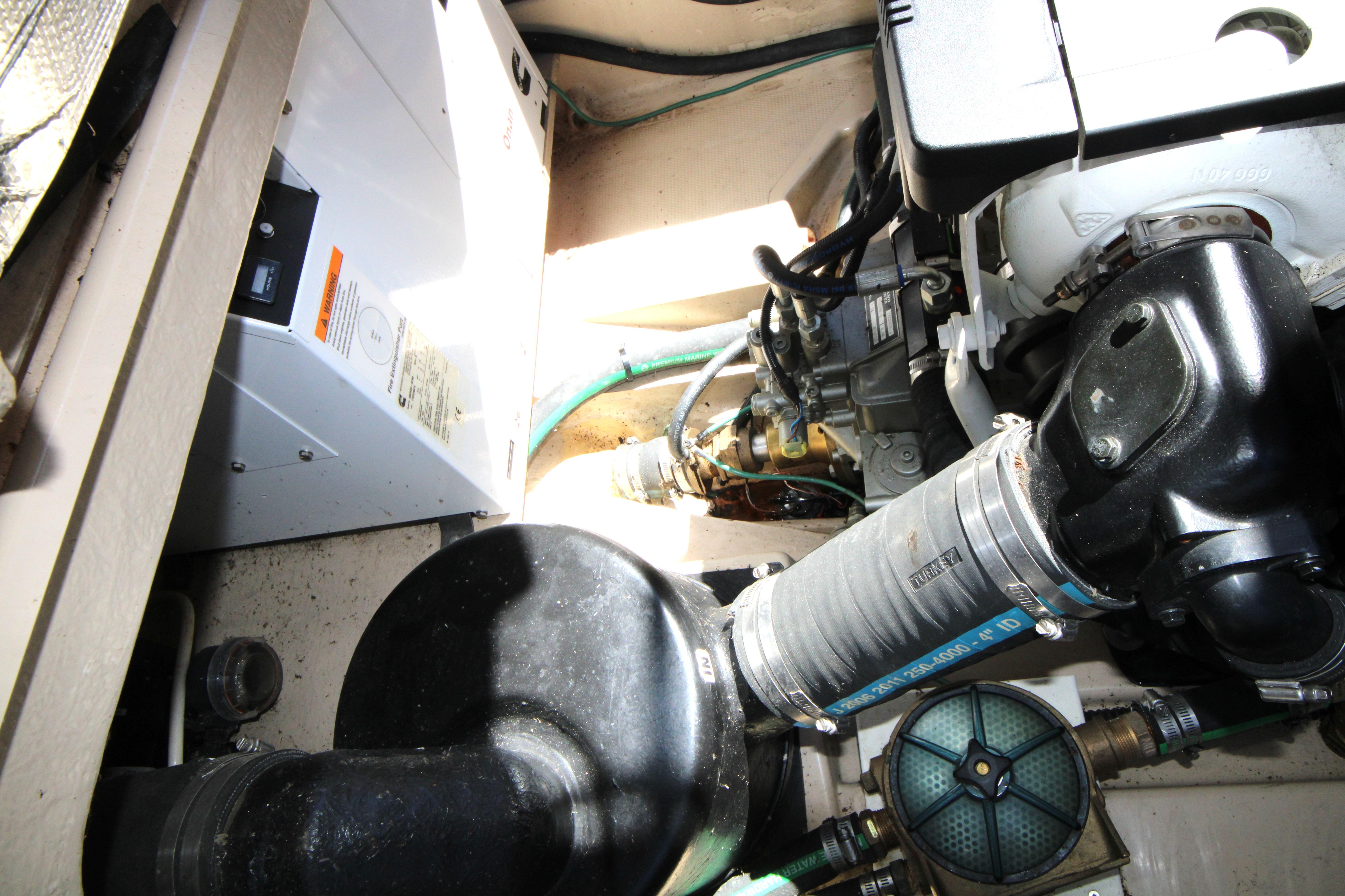 Engine compartment of 2013 Ranger Tugs R-31 CB, showcasing mechanical components and systems.