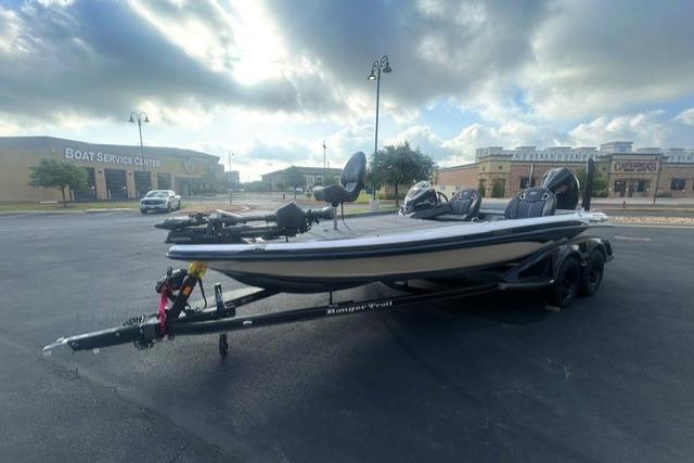 2026 Ranger Z521R boat on trailer in parking lot, cloudy sky background.