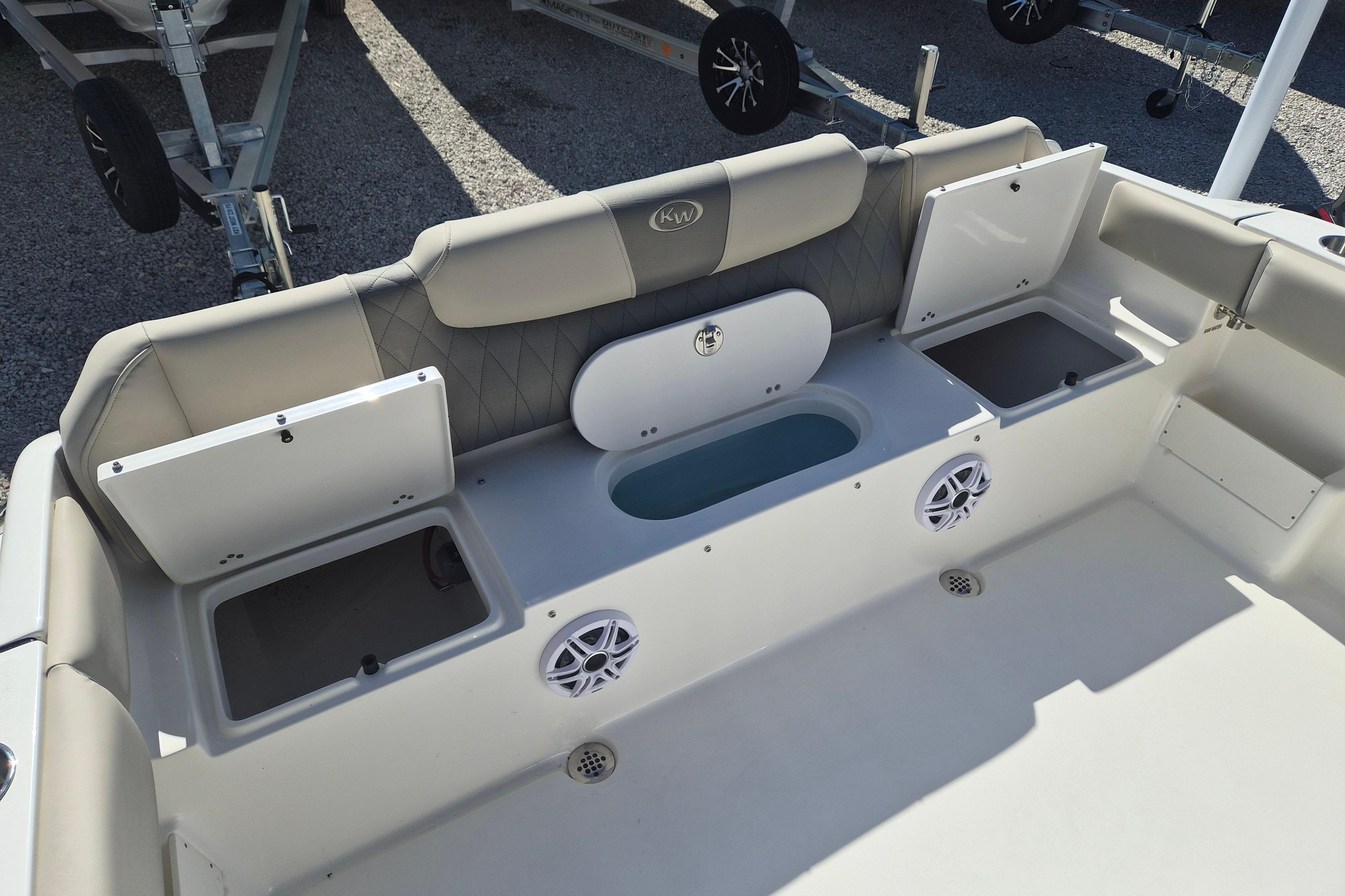 2026 Key West 239 FS boat interior with storage compartments and speakers.