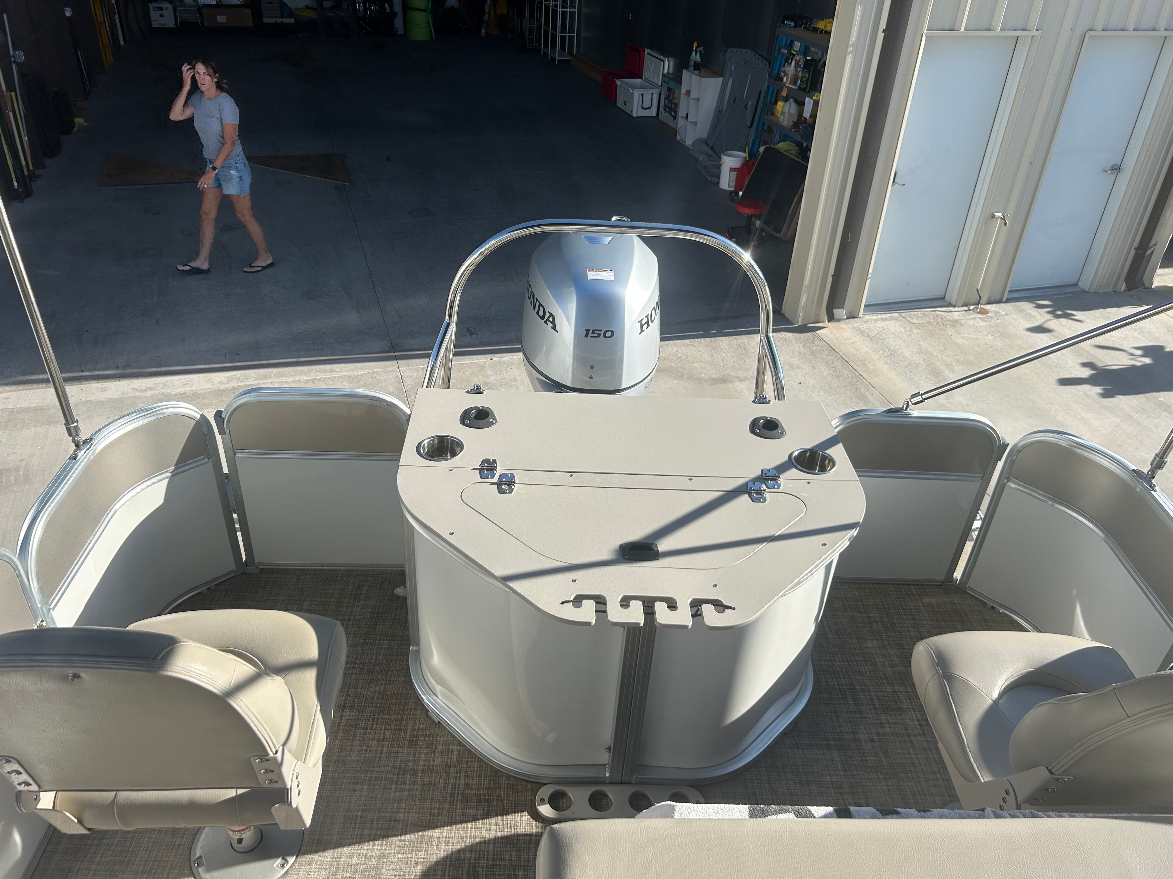 The image shows the stern of a Berkshire 24RFX CTS pontoon boat with a Honda 150 engine.